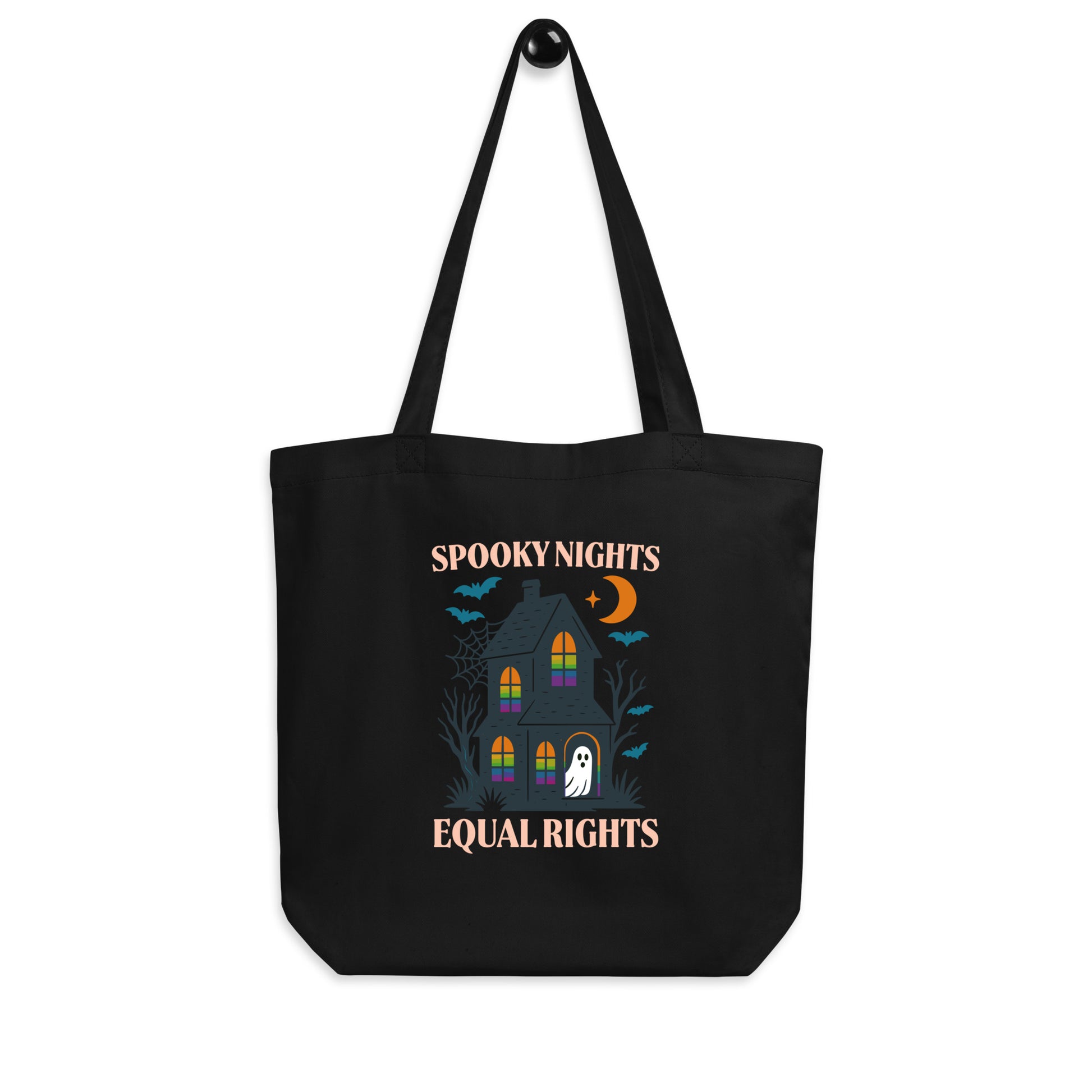 Black “Spooky Nights Equal Rights” tote bag with illustrated haunted house and ghost design. Playful feminist Halloween bag by Blue Wave USA.