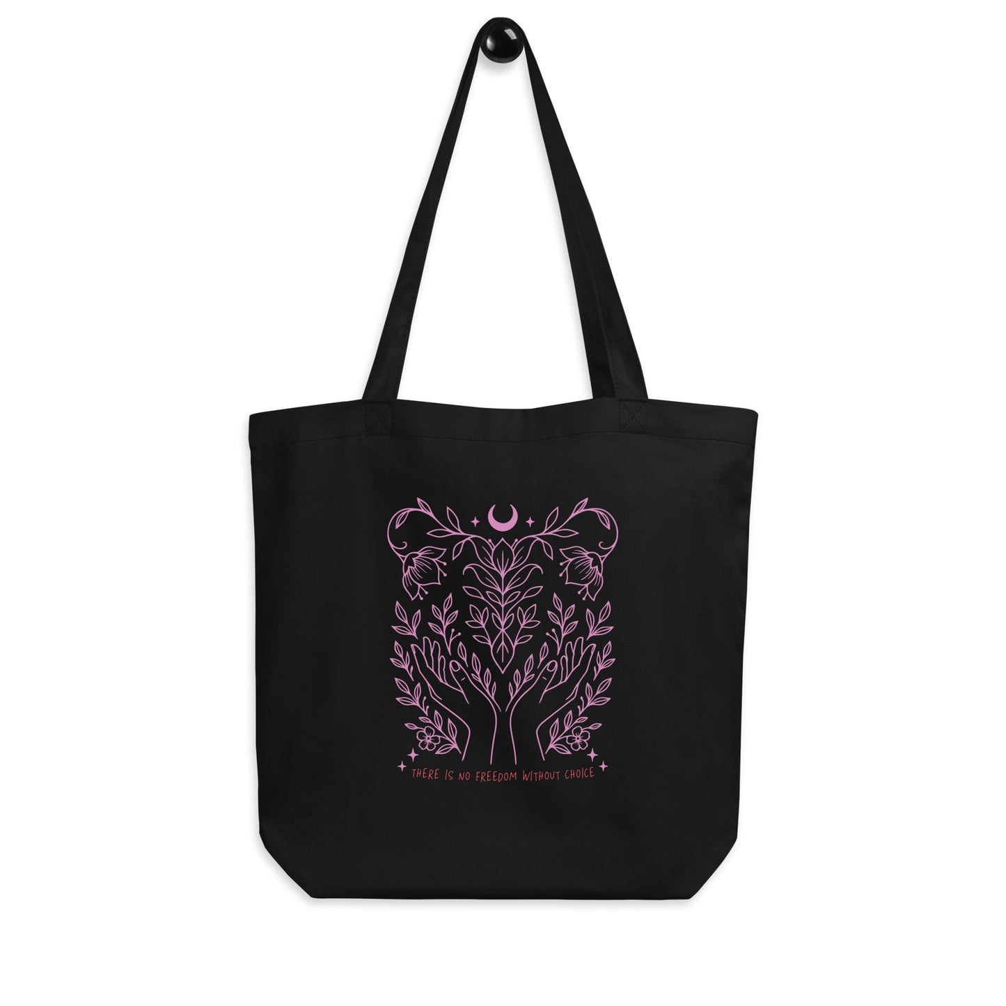 Front view of the “There Is No Freedom Without Choice” eco tote bag hanging, showing full pink celestial and floral illustration. Feminist pro-choice design by Blue Wave USA.
