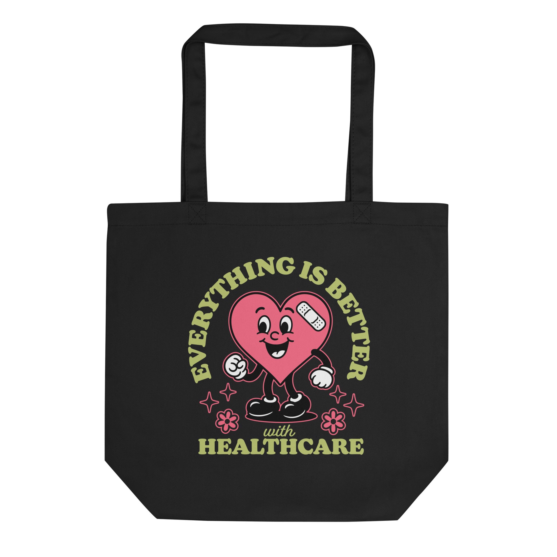 Black eco tote bag with a smiling pink heart cartoon holding medical icons and text that reads “Everything Is Better with Healthcare.”