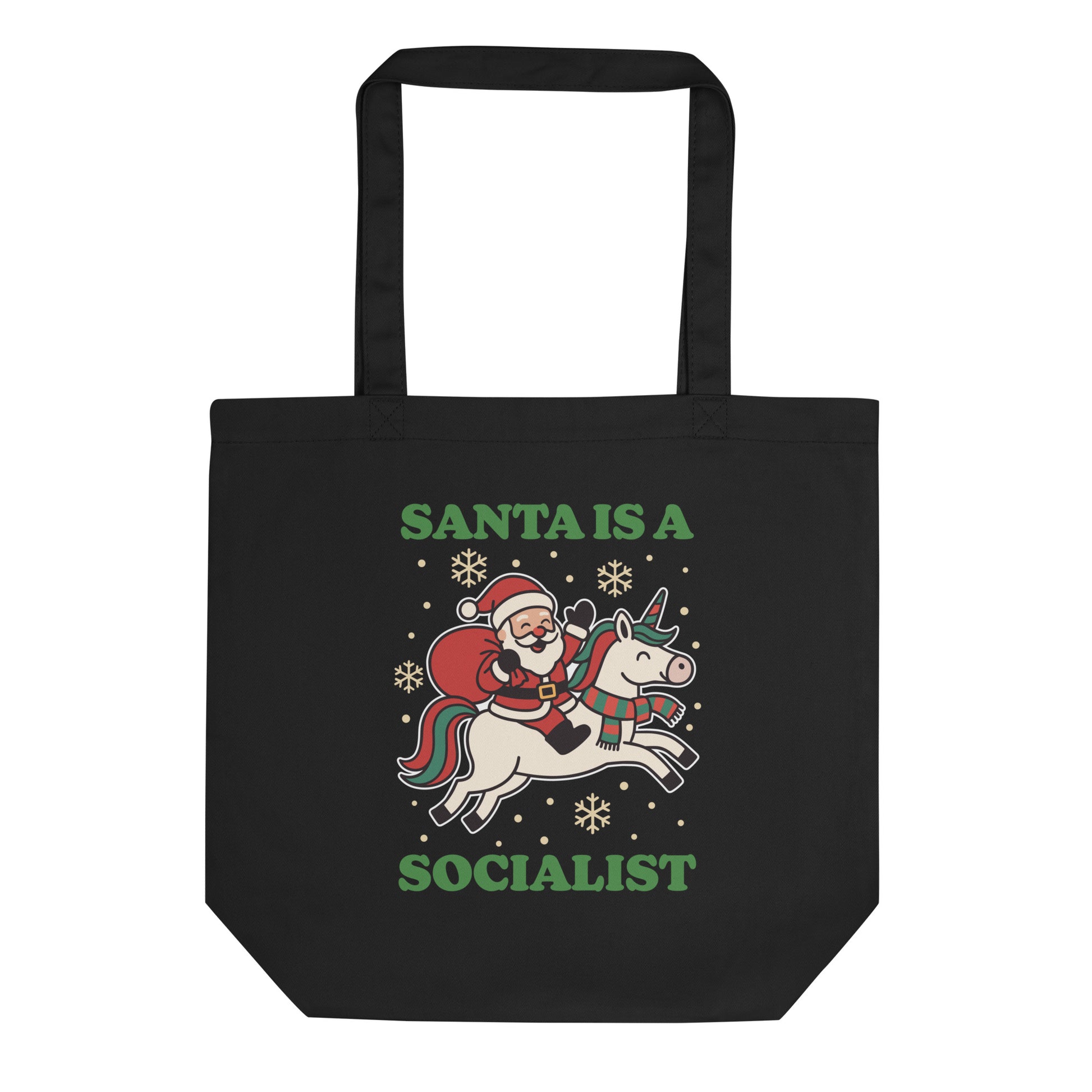 Black tote bag featuring a retro Santa riding a unicorn with decorative holiday stars and the printed message “SANTA IS A SOCIALIST” in green lettering.