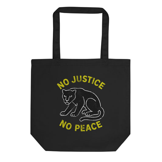 Black eco tote bag featuring a white outlined crouching panther graphic with yellow curved text reading “NO JUSTICE NO PEACE,” presented on plain background for an activist-focused design.