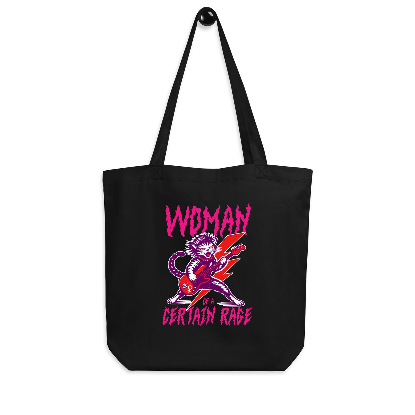 Black eco tote bag displayed on a white background, showcasing the punk rock cat guitar illustration and distressed text reading “WOMAN OF A CERTAIN RAGE,” from Blue Wave USA.
