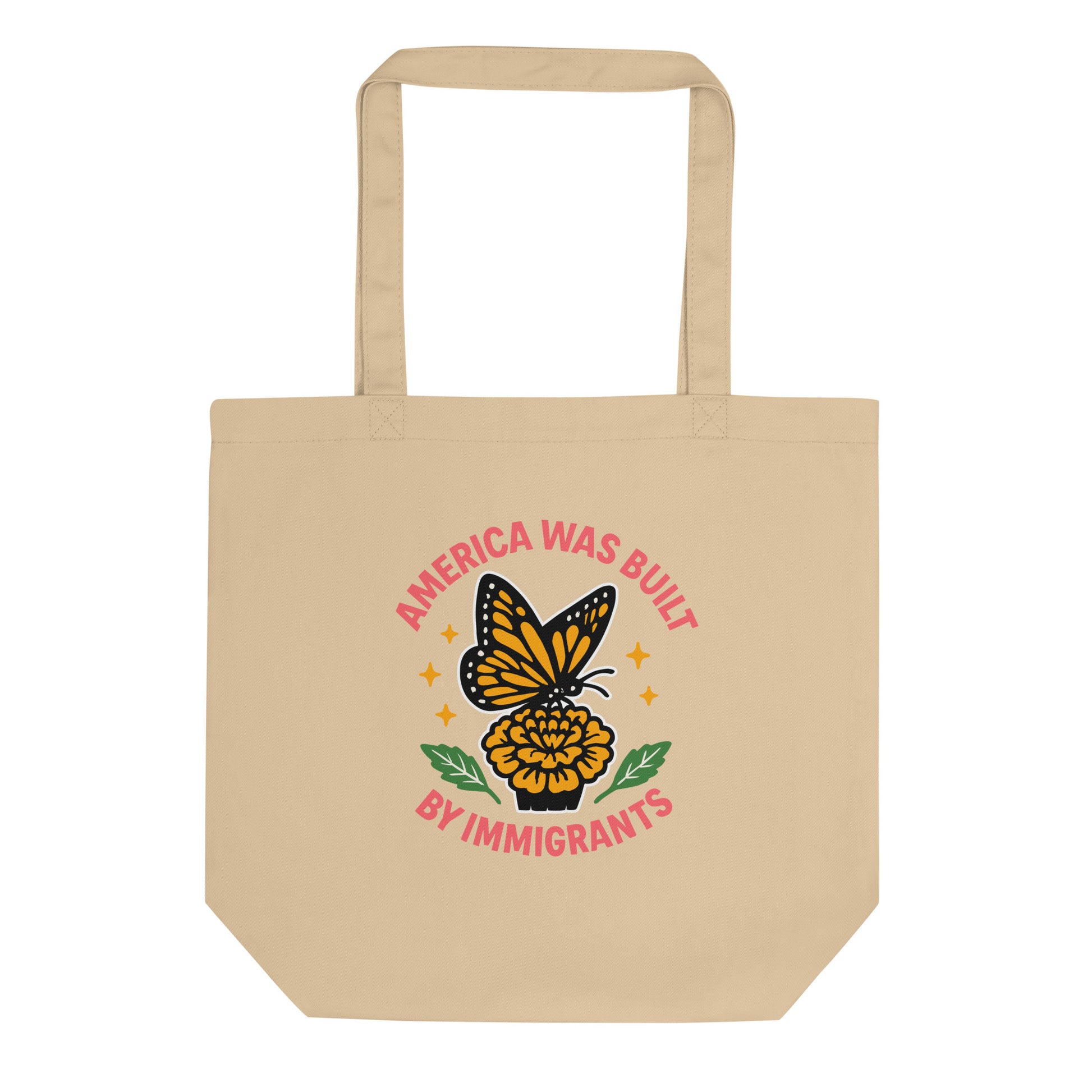 Natural cotton tote bag featuring “America Was Built by Immigrants” butterfly graphic, sustainable progressive design supporting immigrant rights.
