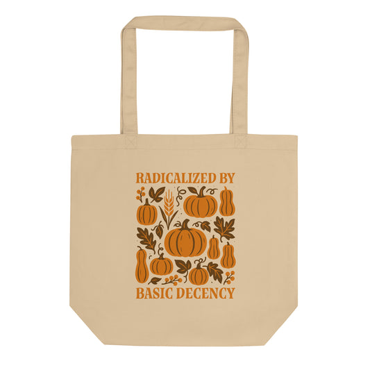 Beige tote bag with “Radicalized by Basic Decency” pumpkin and leaf design, progressive fall activism graphic for kind-hearted voters.