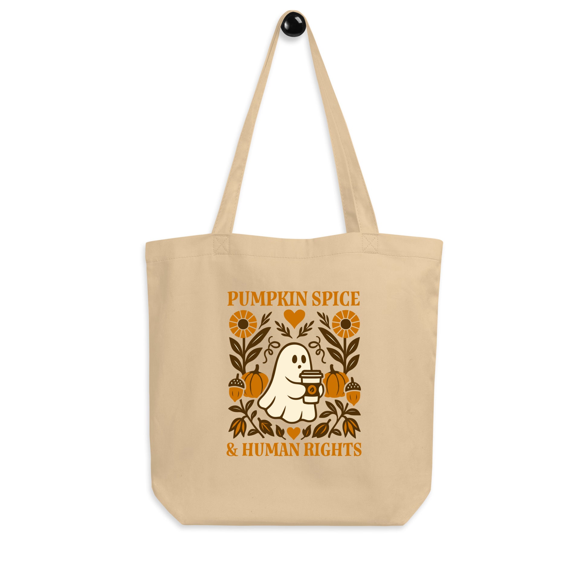 “Pumpkin Spice & Human Rights” eco tote bag with ghost holding coffee, sustainable Blue Wave USA progressive fall design.