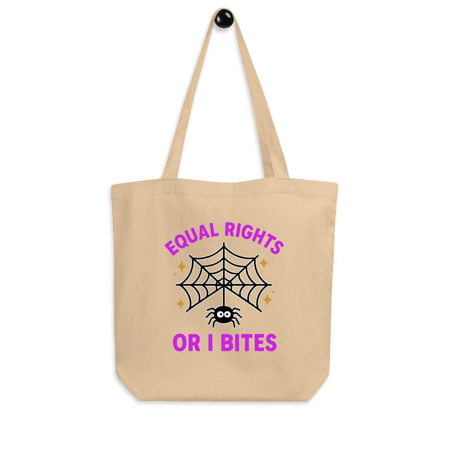 Natural eco tote bag with “Equal Rights or I Bites” text and spider web graphic hanging on display. Feminist Halloween bag by Blue Wave USA.