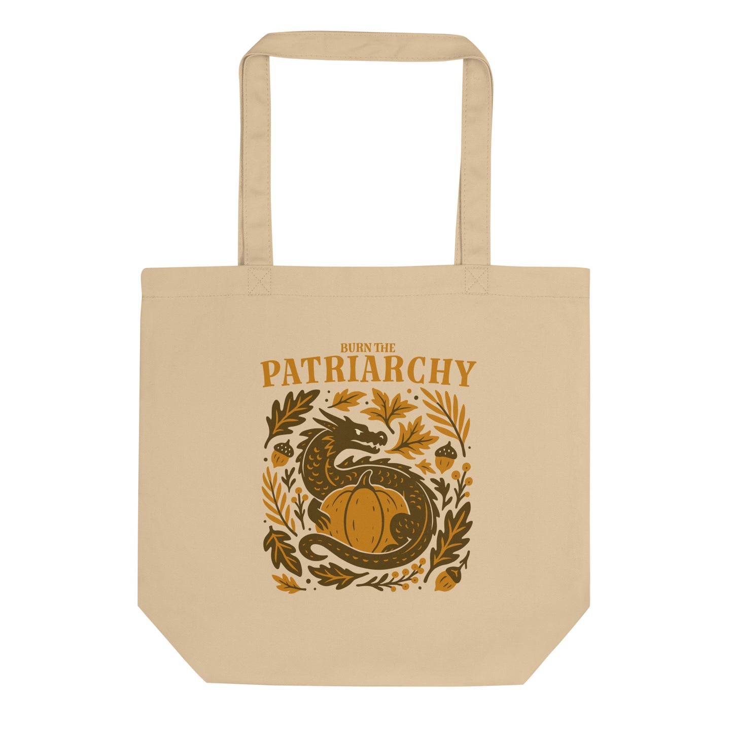 Beige eco tote bag with “Burn the Patriarchy” dragon and pumpkin design, feminist Thanksgiving print with acorns and leaves.