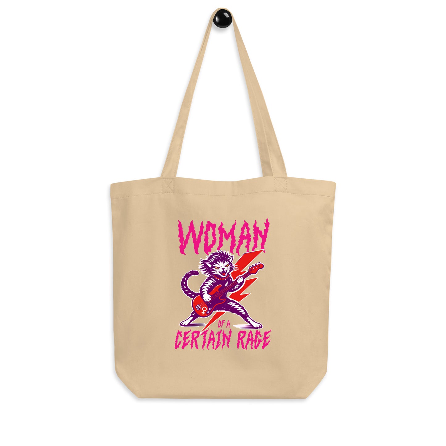 Natural canvas eco tote bag displayed flat, featuring a feminist punk rock cat playing electric guitar with bold distressed lettering reading “WOMAN OF A CERTAIN RAGE.”