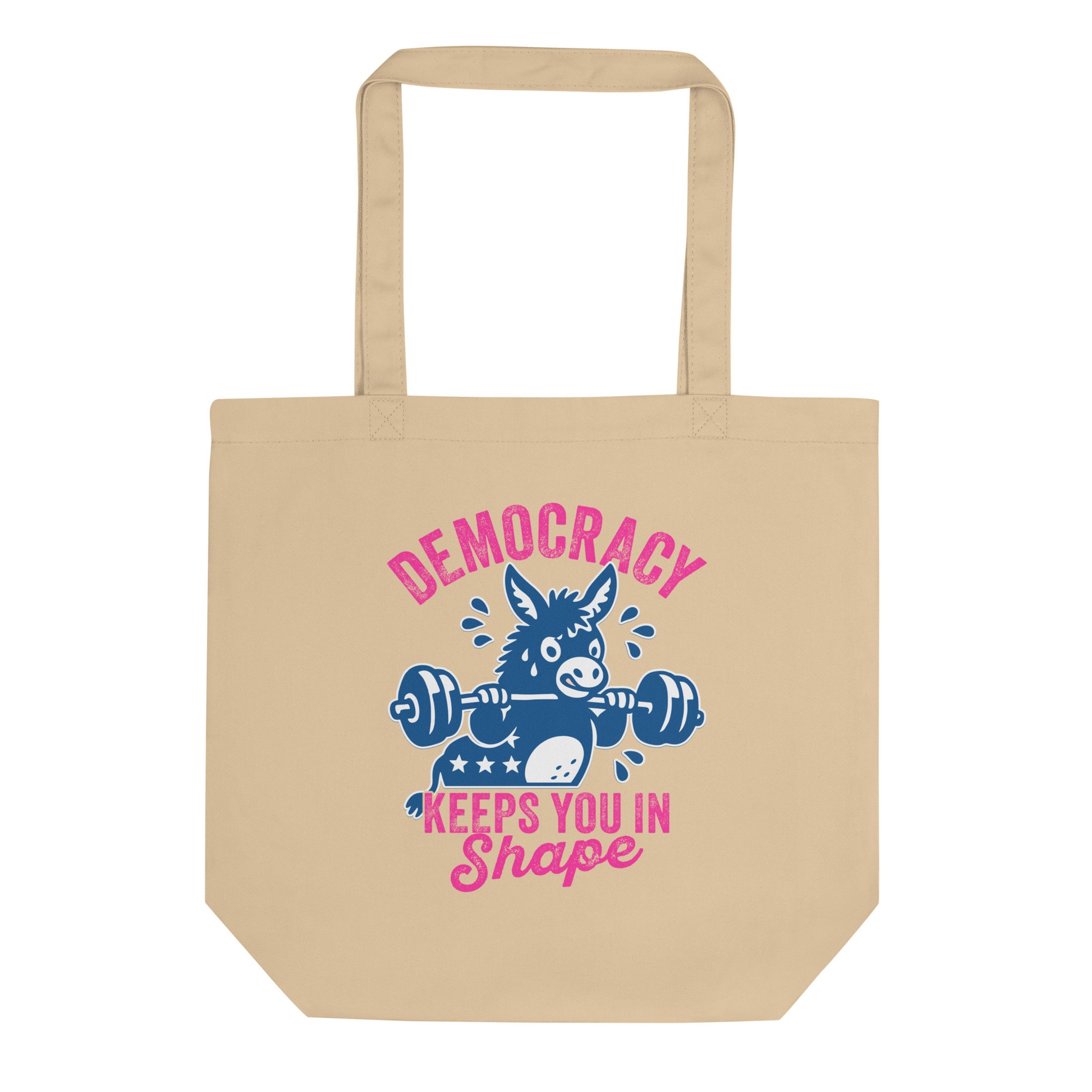 Eco tote bag featuring a blue donkey lifting a barbell with pink “Democracy Keeps You in Shape” text, fitness-inspired political humor artwork for everyday progressive accessories.