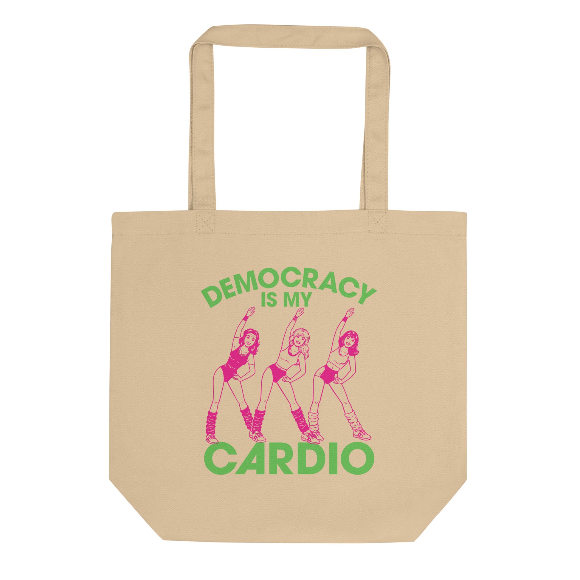 Eco tote bag featuring retro pink aerobics dancers with green “Democracy Is My Cardio” text, vintage fitness-inspired political humor artwork for progressive everyday accessories.