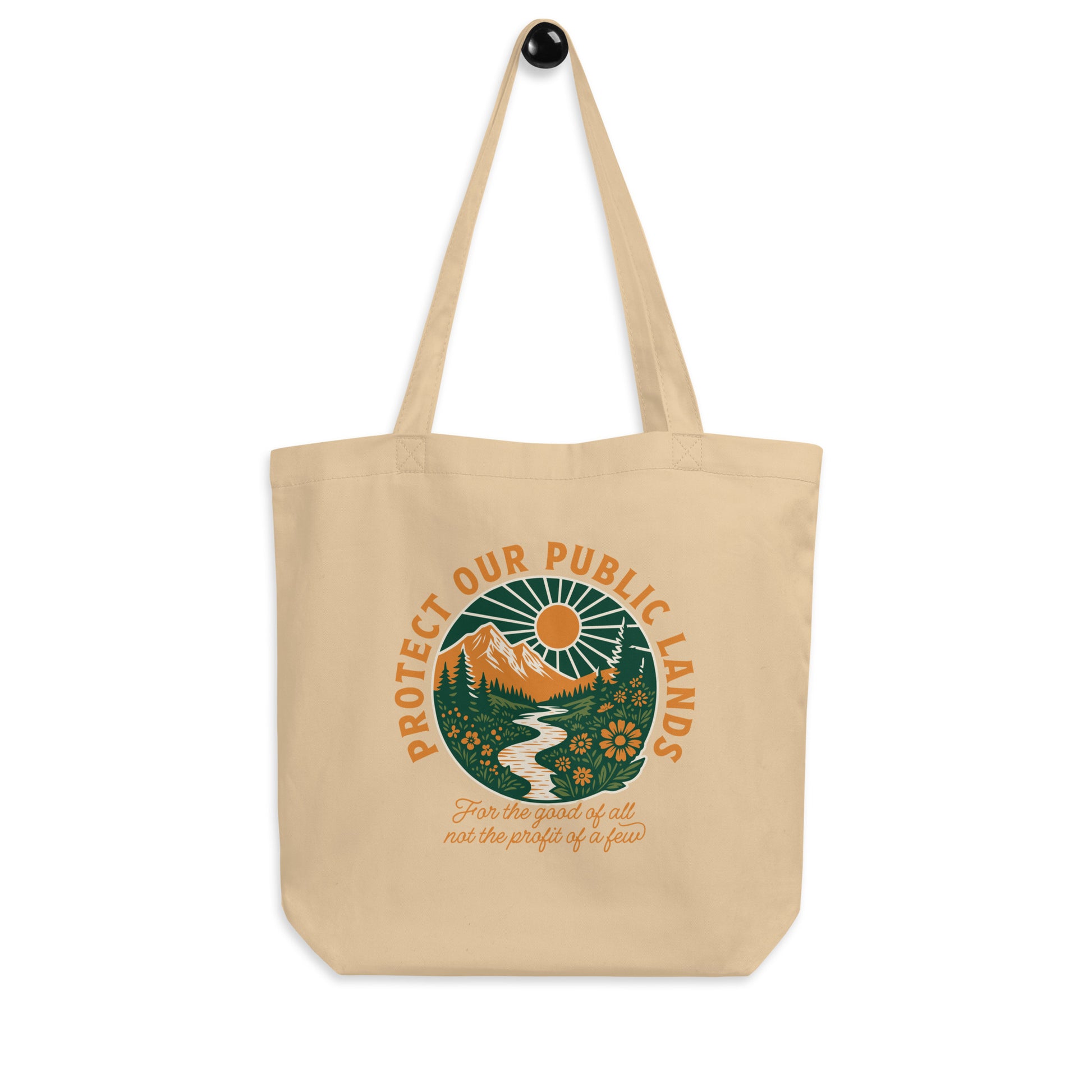 Natural cotton eco tote bag showcasing a vintage-style landscape graphic with mountains, forests, wildlife, and a public lands protection message.