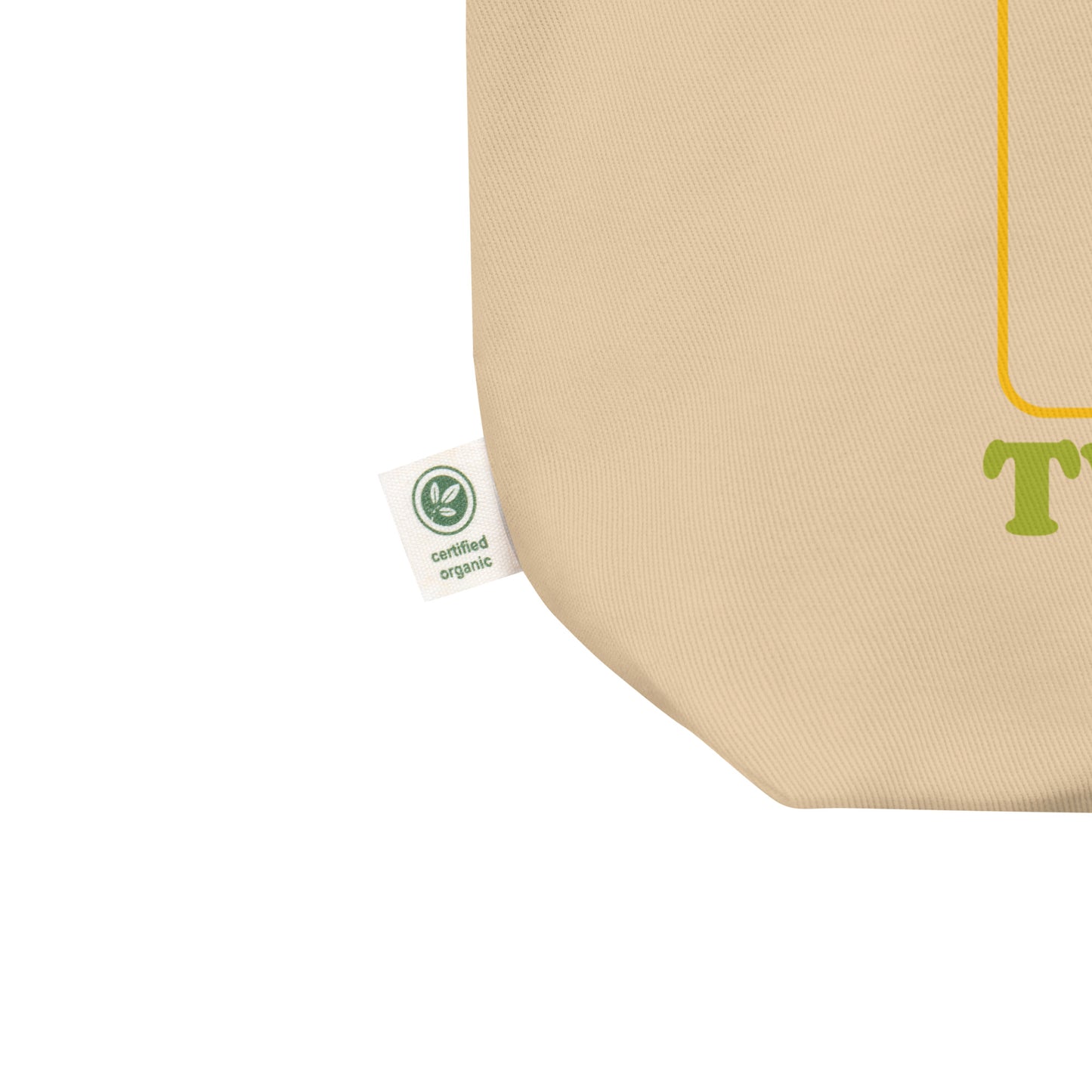 Close-up eco tote corner showing natural canvas texture with partial Birdie Sanders artwork and visible tweeted slogan detail.