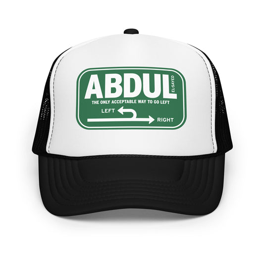 Black and white foam trucker hat featuring green Michigan left road sign graphic with “Abdul El-Sayed” text inspired by classic highway signage.