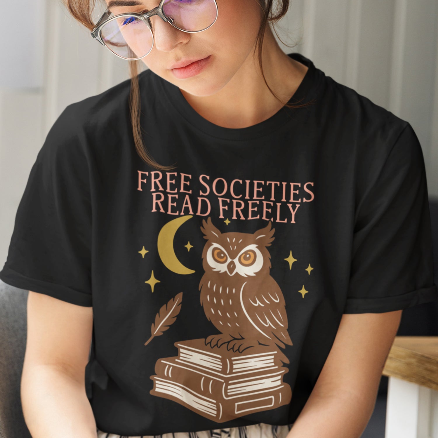 Model wearing “Free Societies Read Freely” banned books owl t-shirt, progressive apparel by Blue Wave USA.