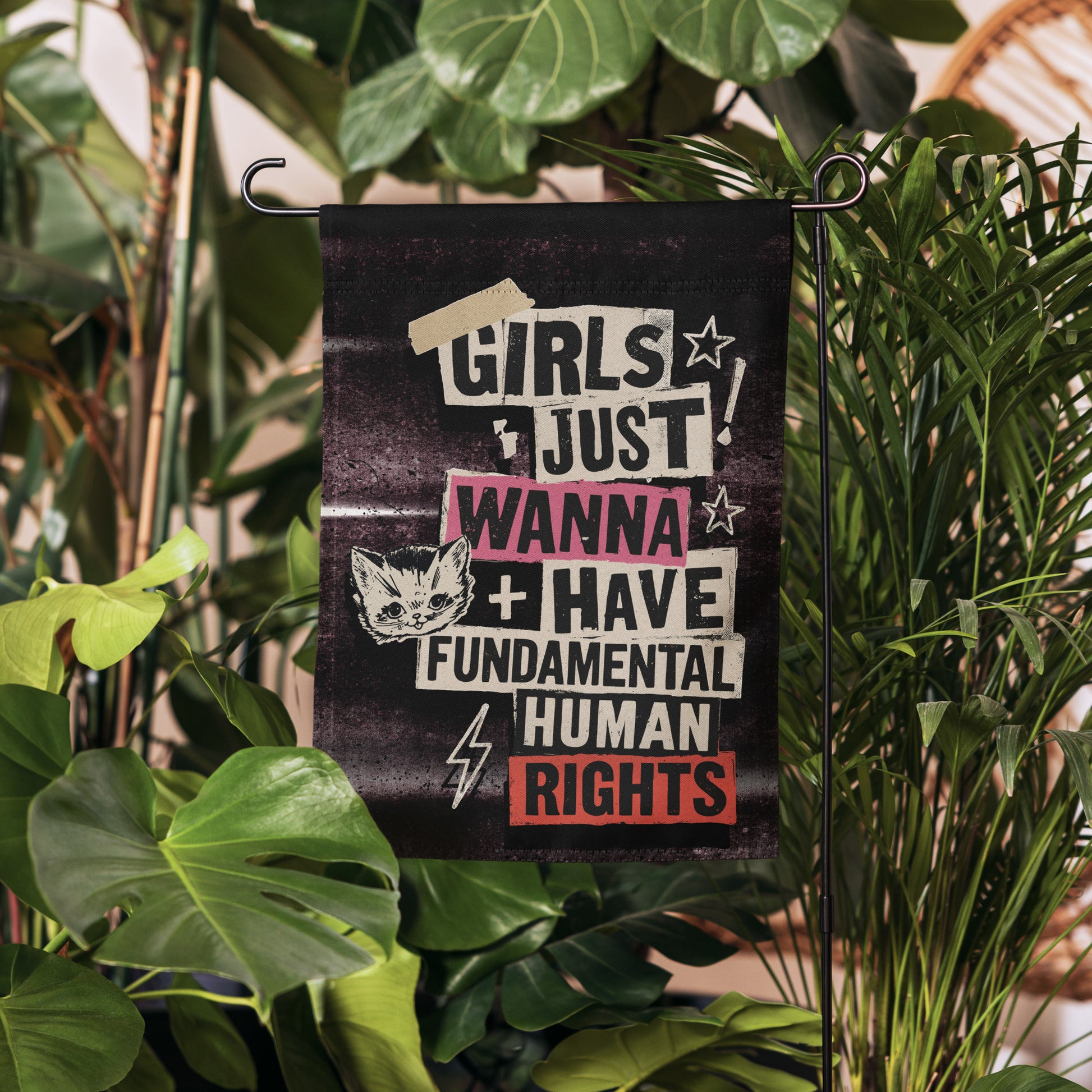 Lifestyle Image: Garden setting with Girls Just Wanna Have Fundamental Human Rights Punk Flag proudly displayed outdoors