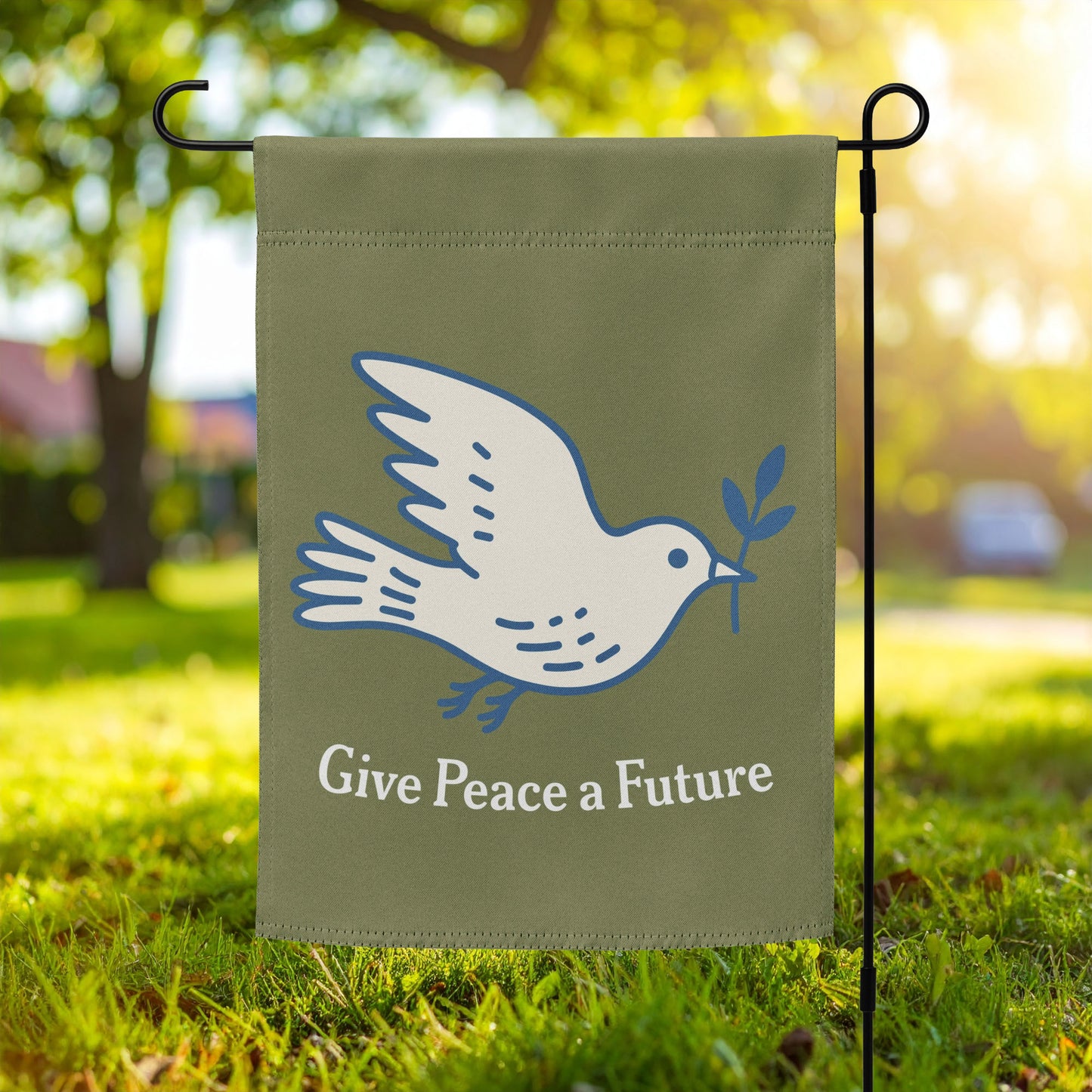 Garden flag featuring white dove carrying an olive branch with “Give Peace a Future” text on olive green background, minimalist anti-war outdoor decor.