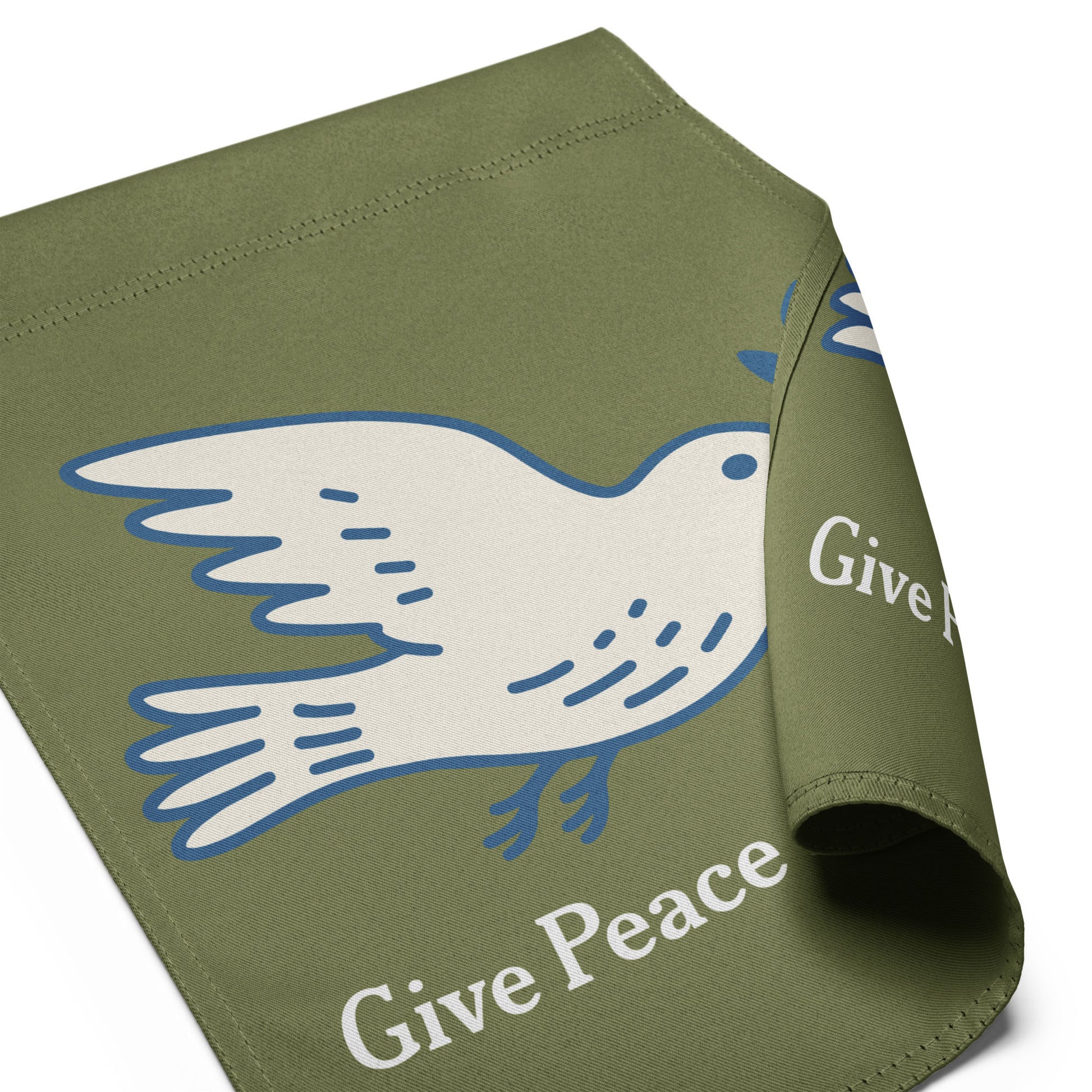 Folded olive green garden flag displaying partial dove peace symbol with visible hopeful peace wording in soft activist outdoor design.