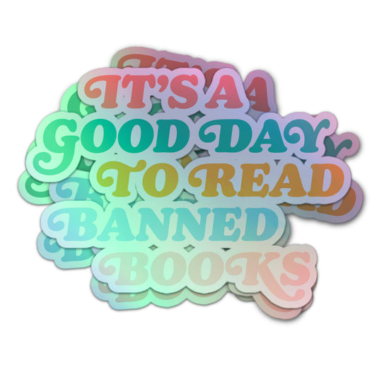 Holographic sticker with the text “It’s A Good Day To Read Banned Books” in colorful, retro-style letters.