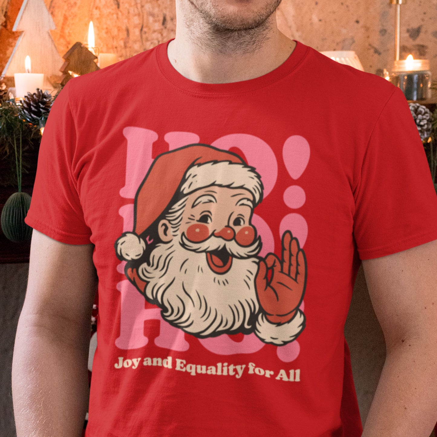 Person in a warm holiday setting wearing the red version of the Santa “Joy and Equality for All” design, blending festive cheer with a message of equality.