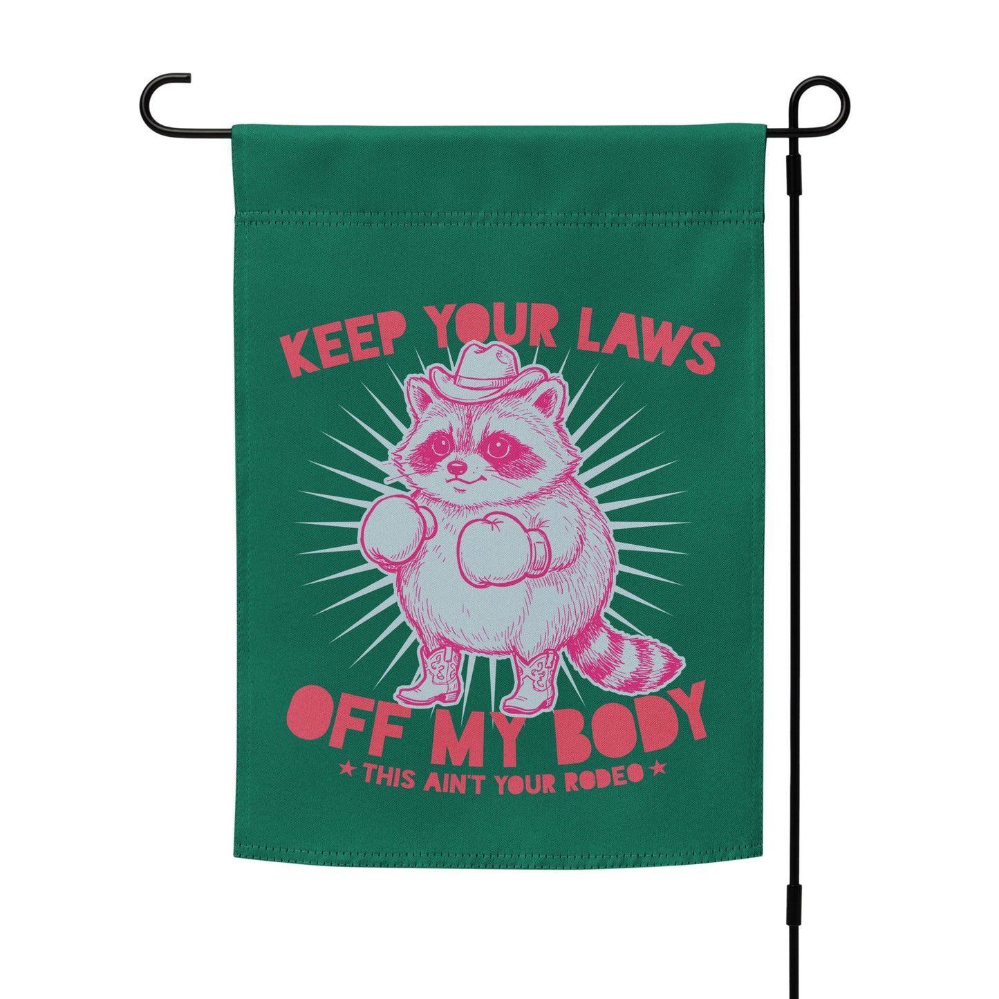 Garden flag mockup on stand featuring cowboy raccoon graphic and reproductive rights slogan in bold western feminist outdoor decor style.