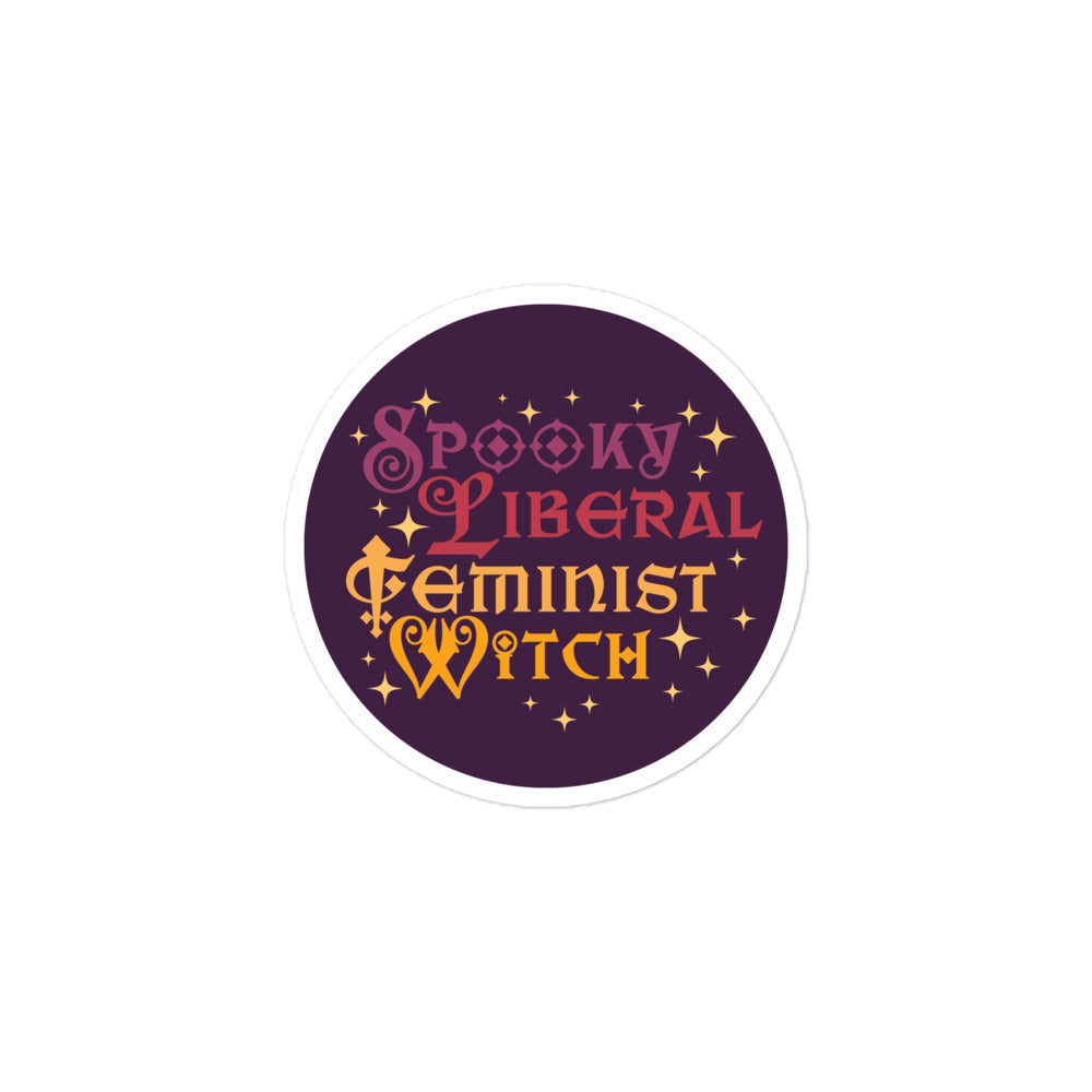 Circular vinyl sticker showing stylized typography reading “Spooky Liberal Feminist Witch” with celestial star details on deep purple background.