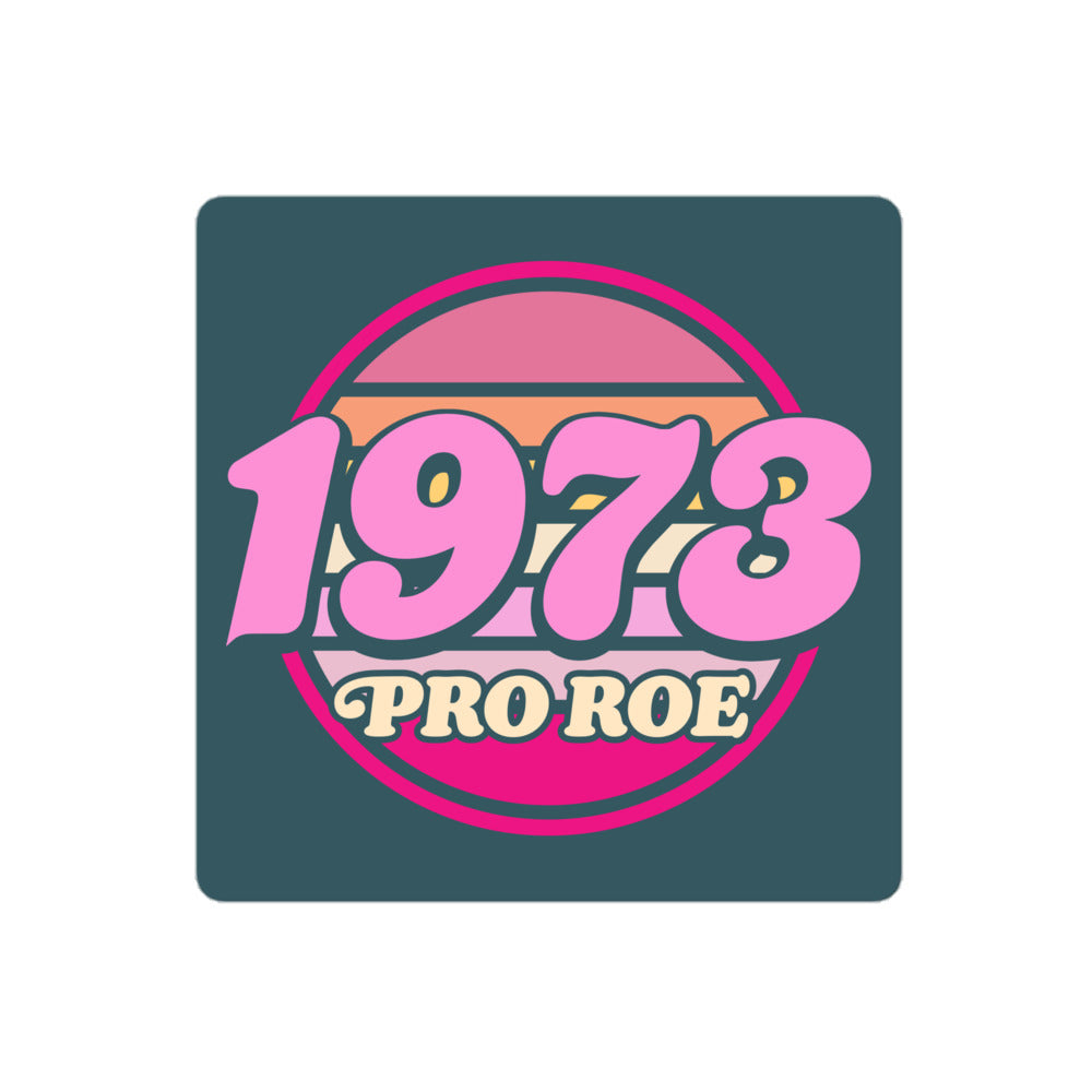 Close-up view of the square vinyl sticker showing the retro pink circular “1973 PRO ROE” emblem on a dark teal background, clean reproduction from Blue Wave USA.
