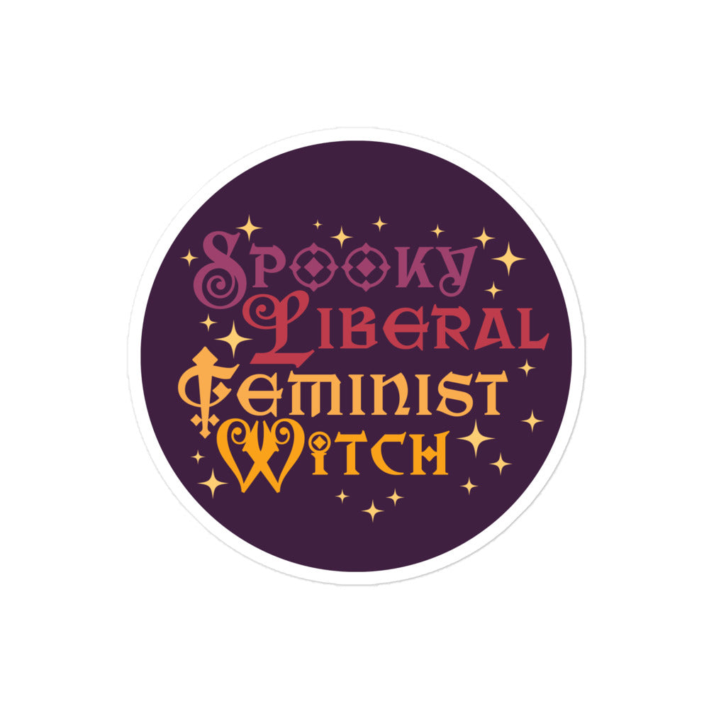 Round activist sticker featuring decorative gothic lettering with phrase “Spooky Liberal Feminist Witch,” celestial star motifs, and bold feminist graphic style.
