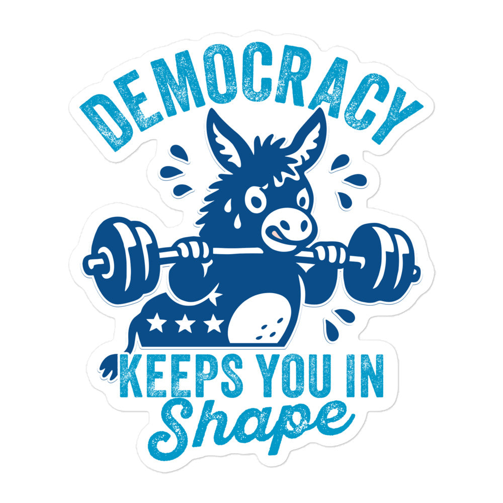 Political donkey sticker with weightlifting artwork and distressed blue typography, showcasing the “Keeps You in Shape” democracy message with retro gym energy and activist design appeal.