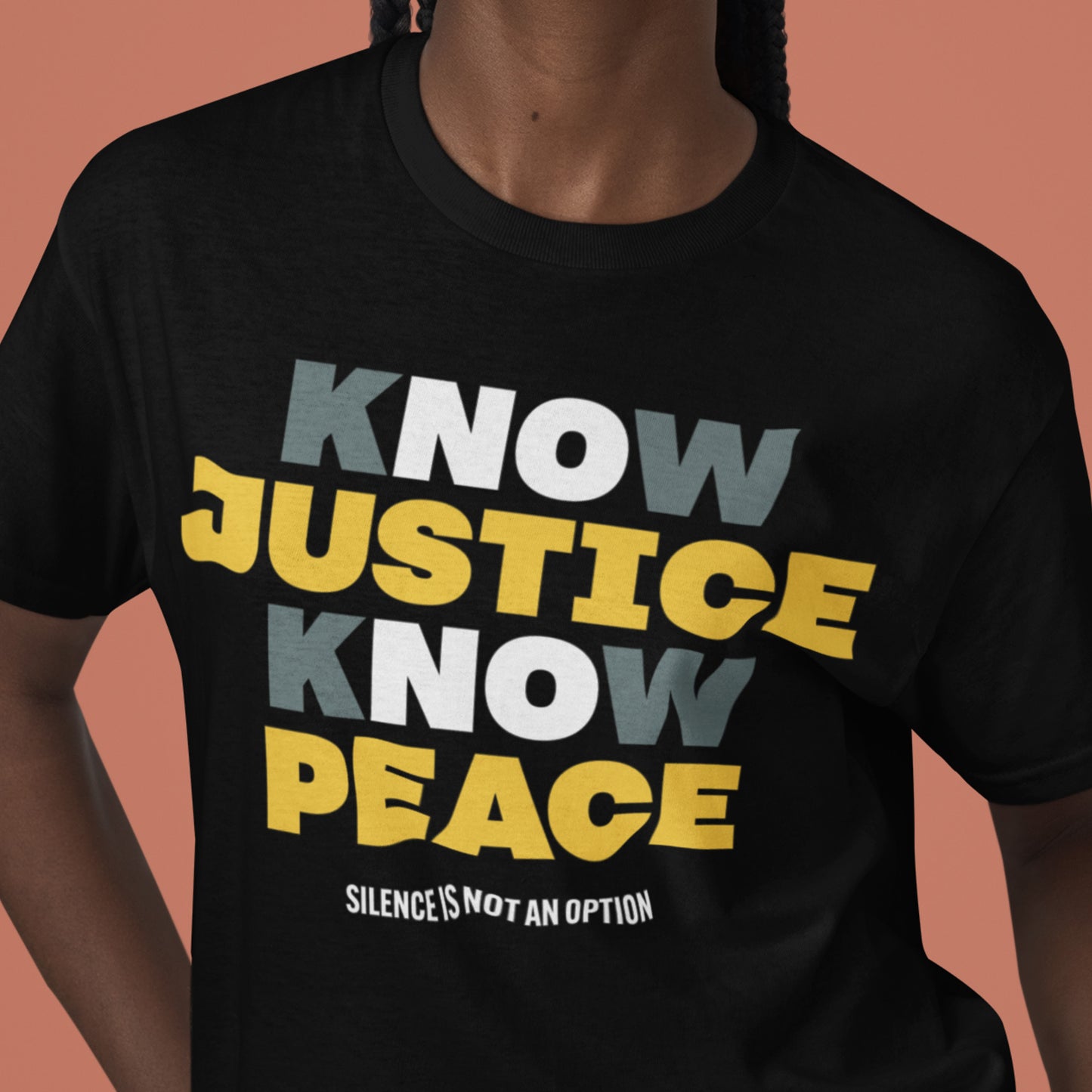 Person wearing the Know Justice Know Peace tee in black, showing the strong typography across the chest. A statement piece from Blue Wave USA built for solidarity and everyday protest wear.
