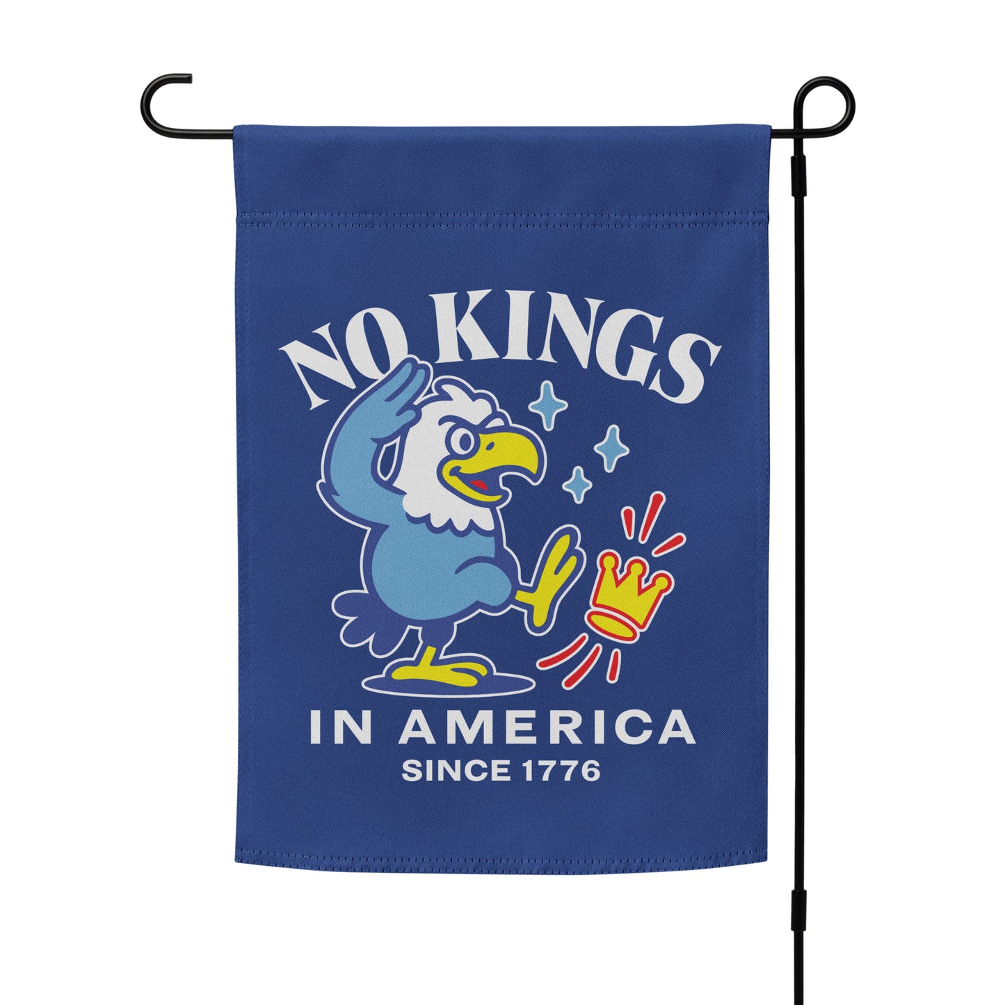 Patriotic garden flag mounted on black stand featuring cartoon eagle and the slogan “NO KINGS IN AMERICA SINCE 1776.”