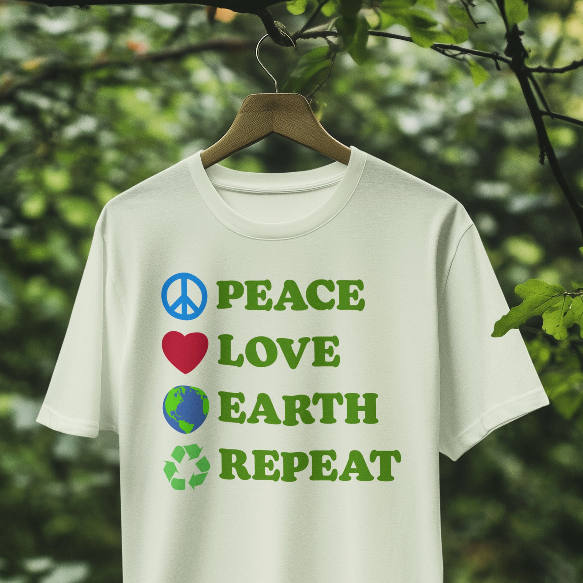 White “Peace Love Earth Repeat” eco-conscious climate change t-shirt, displayed hanging among greenery.