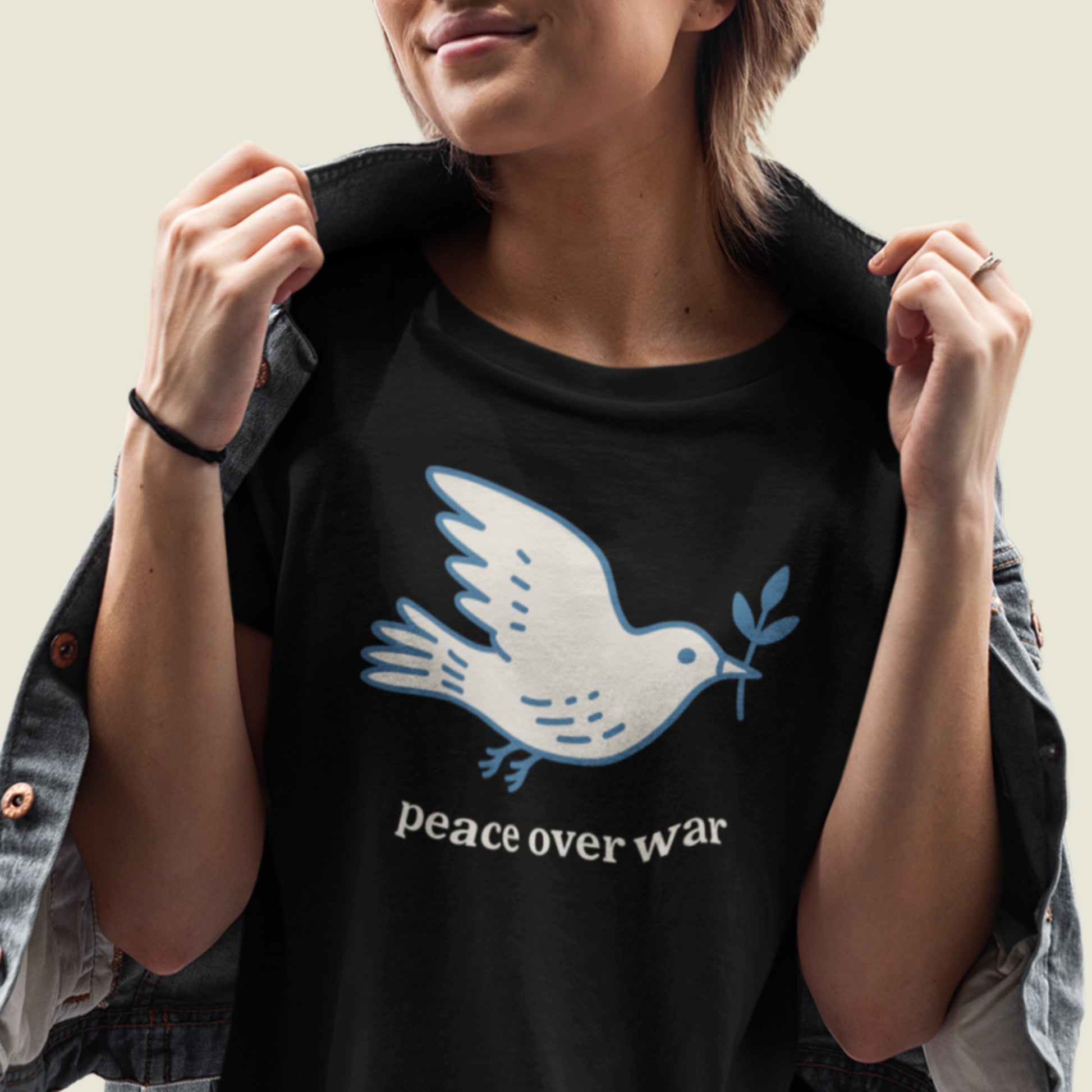 Blue Wave USA unisex tee worn in lifestyle mockup, showcasing dove peace artwork and “peace over war” wording in calm justice-focused style.