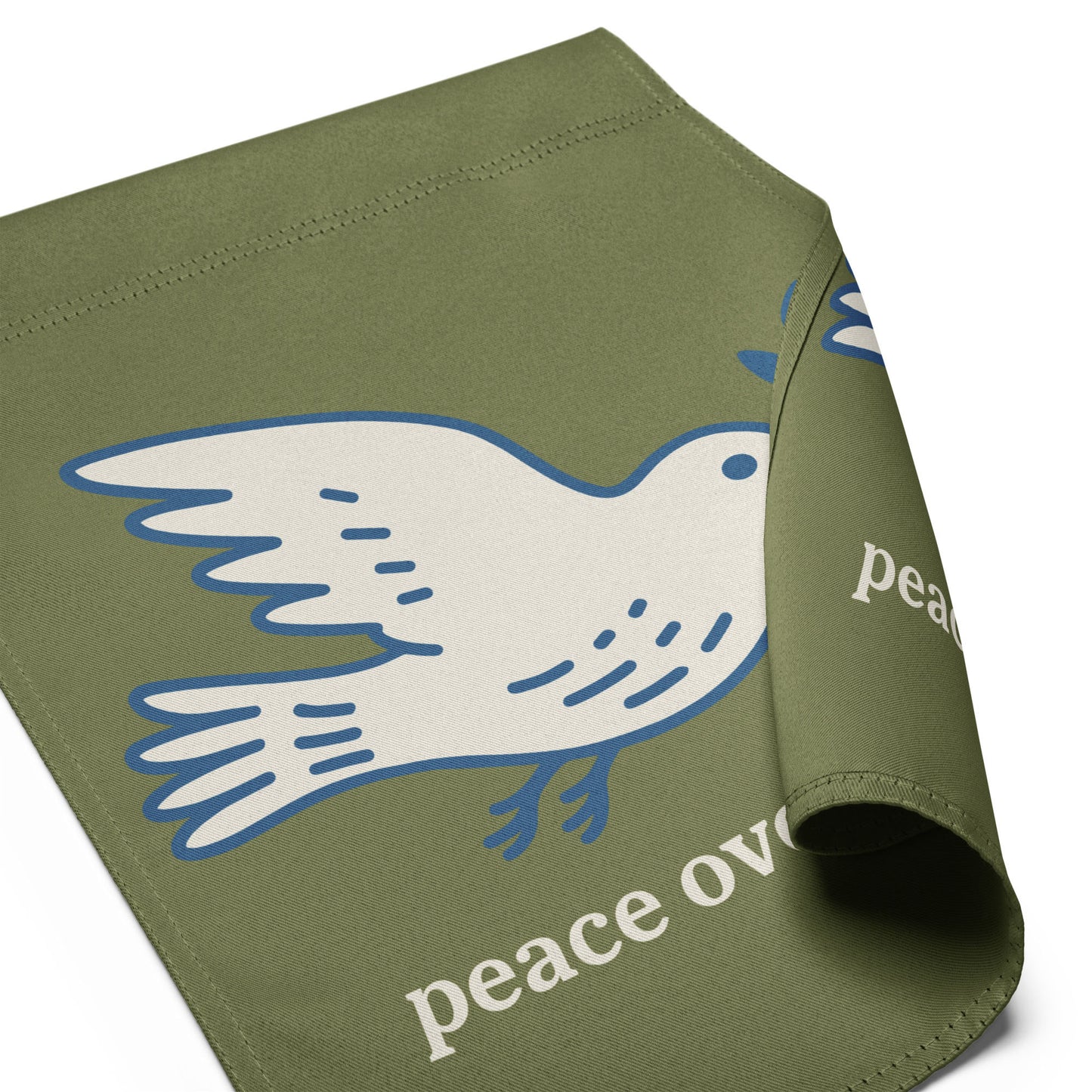 Folded olive green garden flag displaying partial dove peace symbol with visible “peace over war” wording in soft activist outdoor design.