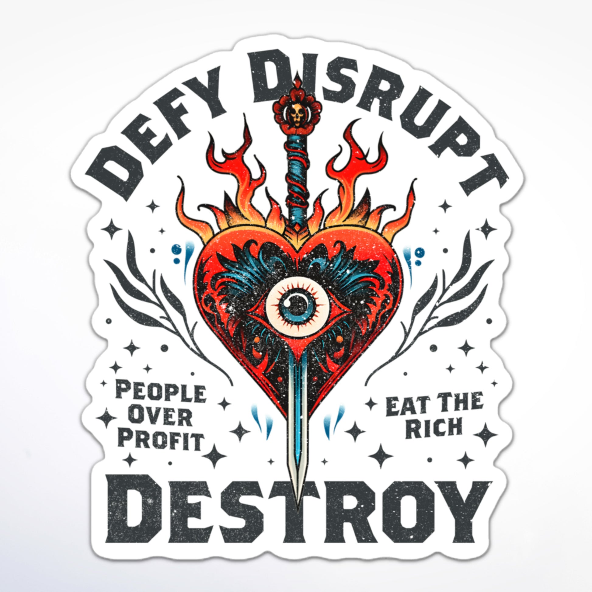 Anti-capitalist sticker with bold text: “Defy Disrupt Destroy,” “People Over Profit,” and “Eat The Rich” alongside a tattoo-style flaming heart and sword.