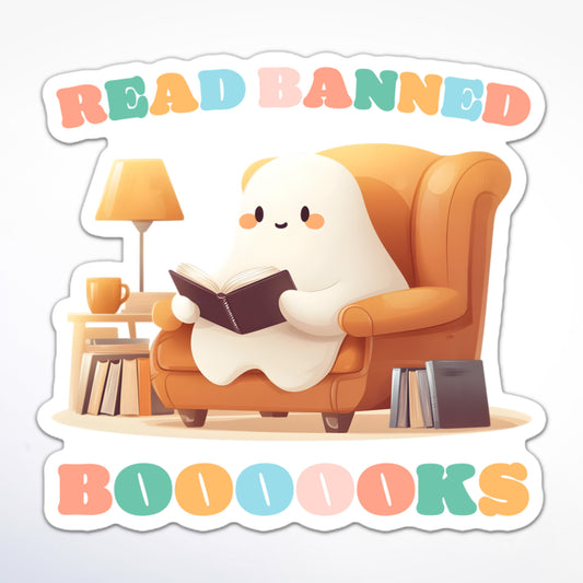 Sticker of a cute ghost sitting in a cozy armchair reading a book, surrounded by stacks of books, lamp, and a side table, with colorful text “Read Banned Boooooks.”