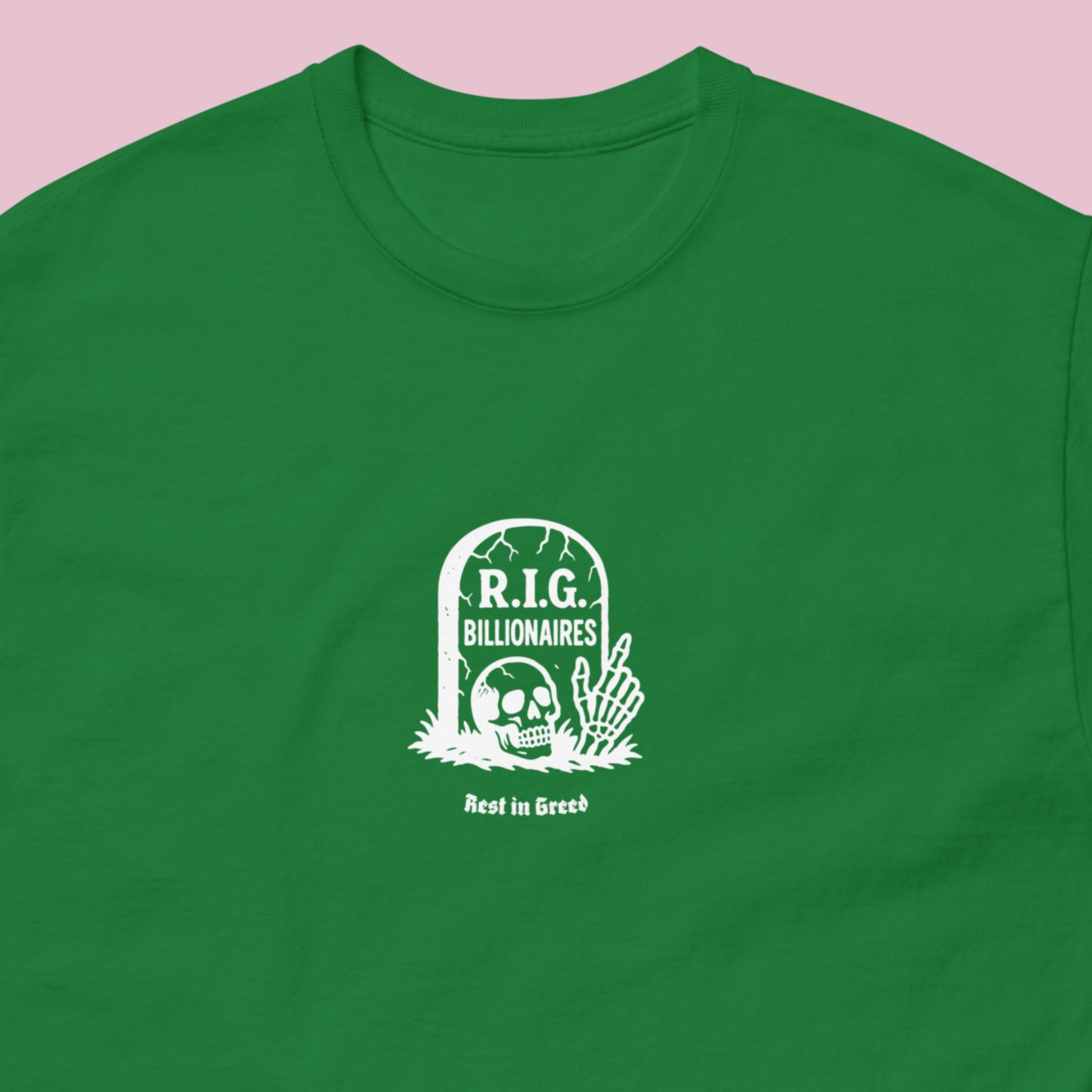 Green unisex t-shirt displaying a minimalist “Rest in Greed” graphic featuring a satirical tombstone design critiquing billionaire wealth and corporate greed.