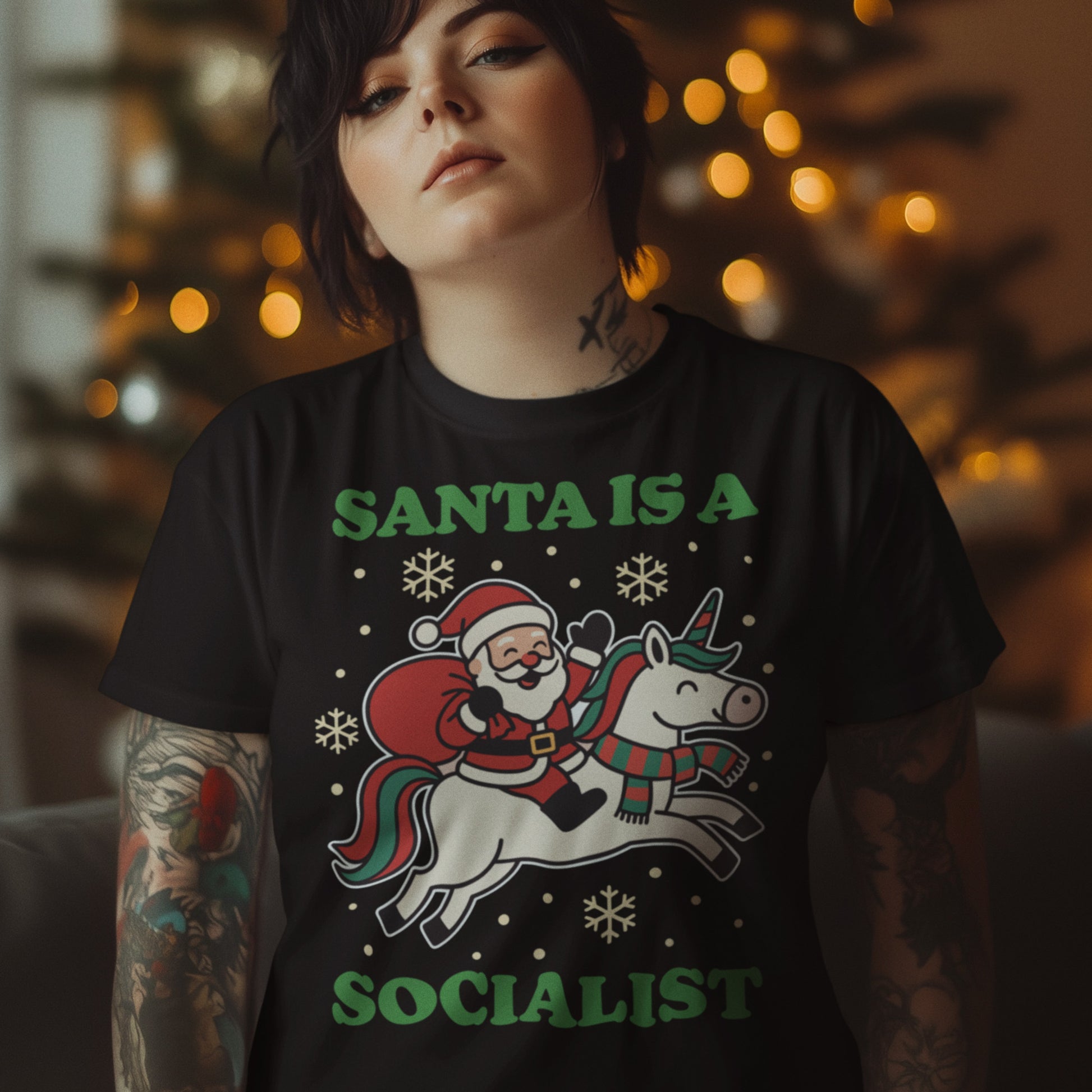 Model wearing a black t-shirt with a vintage Santa riding a unicorn, surrounded by stars, and the printed message “SANTA IS A SOCIALIST,” progressive apparel from Blue Wave USA.