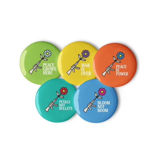 Colorful activist pin buttons with phrases “Peace Grows Here,” “War Is Over,” “Peace Is Power,” “Petals Not Bullets,” and “Bloom Not Boom,” anti-war progressive design with flowers and peace symbols.