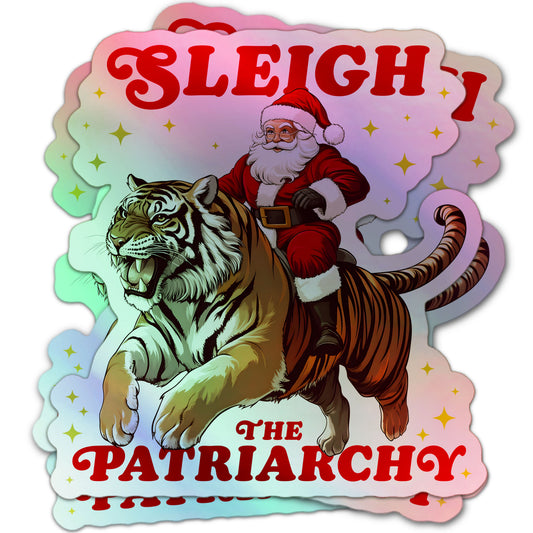 Holographic sticker with Santa Claus riding a roaring tiger and the phrase “Sleigh The Patriarchy.”