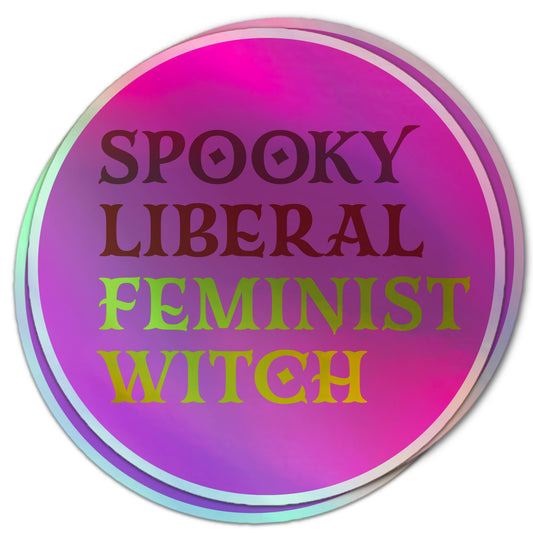 Holographic sticker with the phrase “Spooky Liberal Feminist Witch” in bold, ombré text on a pink and purple background.
