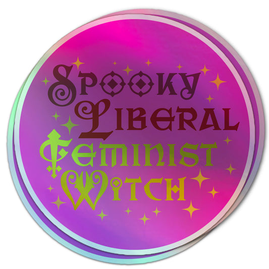 Halloween holographic sticker with “Spooky Liberal Feminist Witch” in whimsical, sparkly lettering on a pink and purple background.