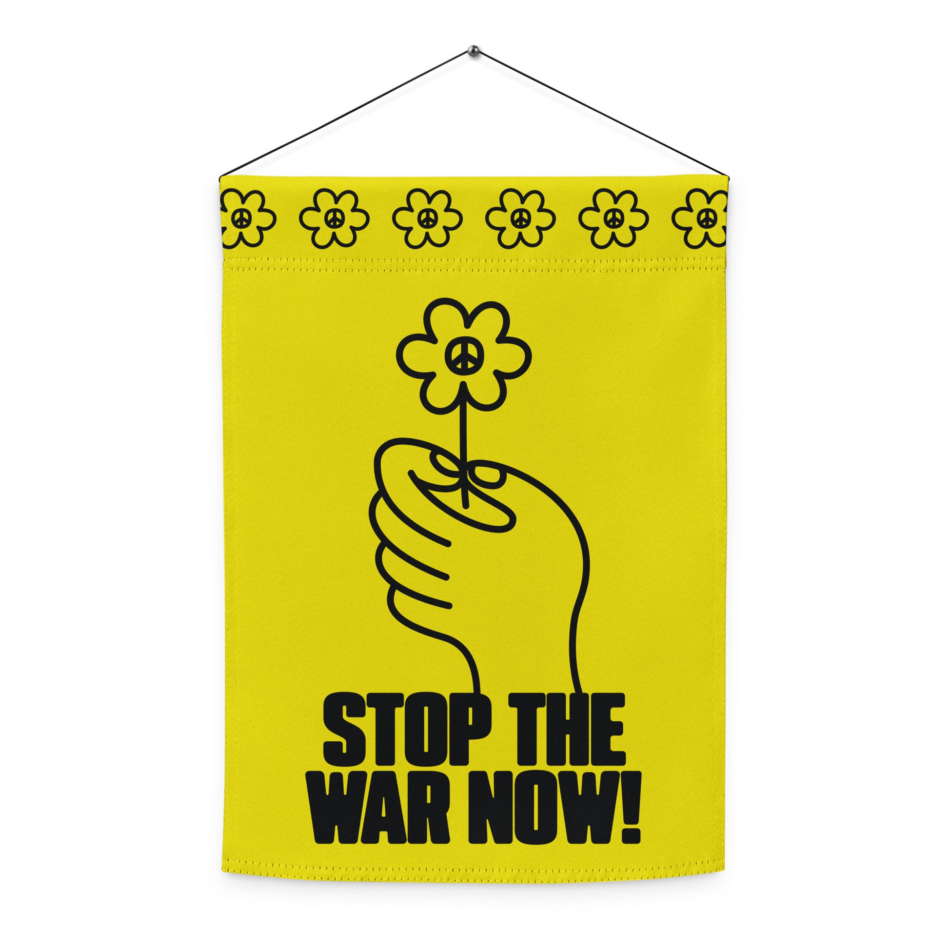 Vertical garden flag with top sleeve and hanging rod featuring flower-in-hand artwork and bold anti-war message across lower panel.