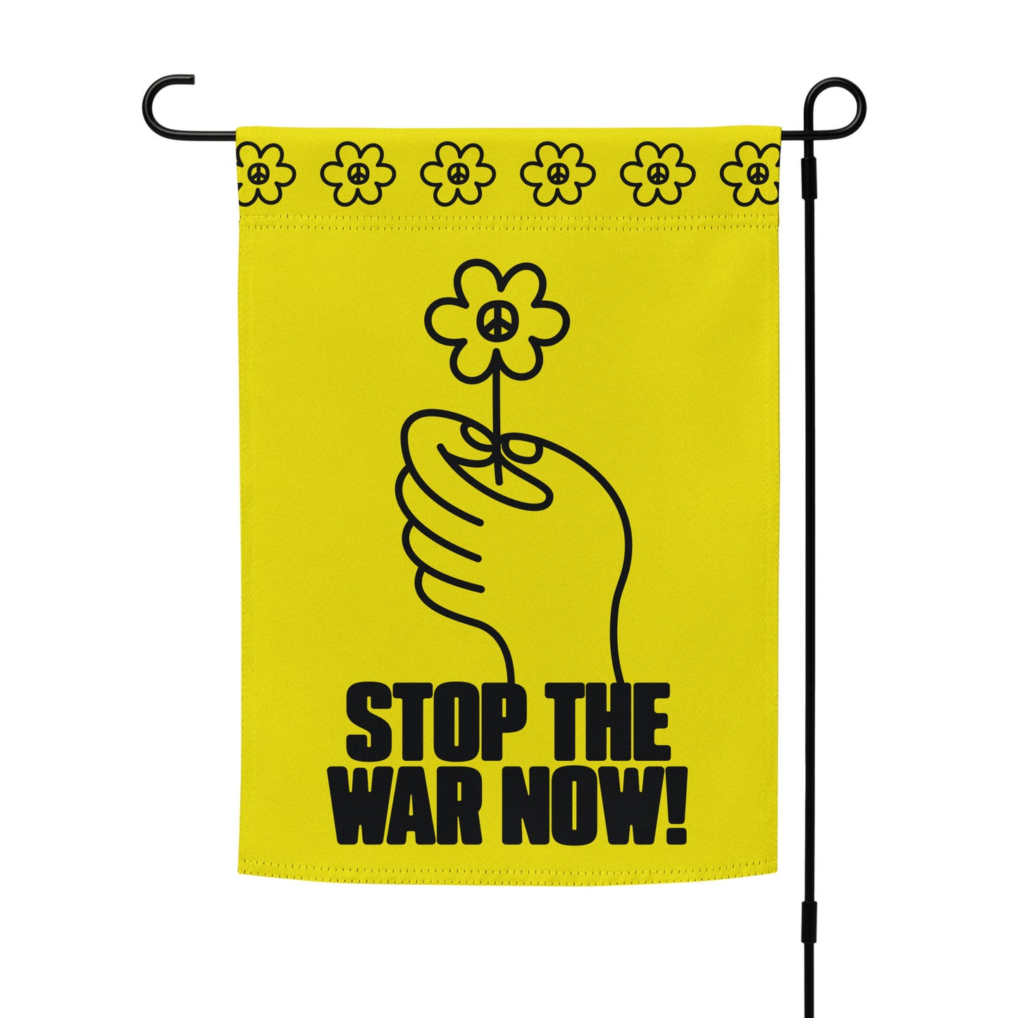 Anti-war garden flag mounted on black stand showing centered hand holding flower graphic with strong “Stop the War Now!” statement.