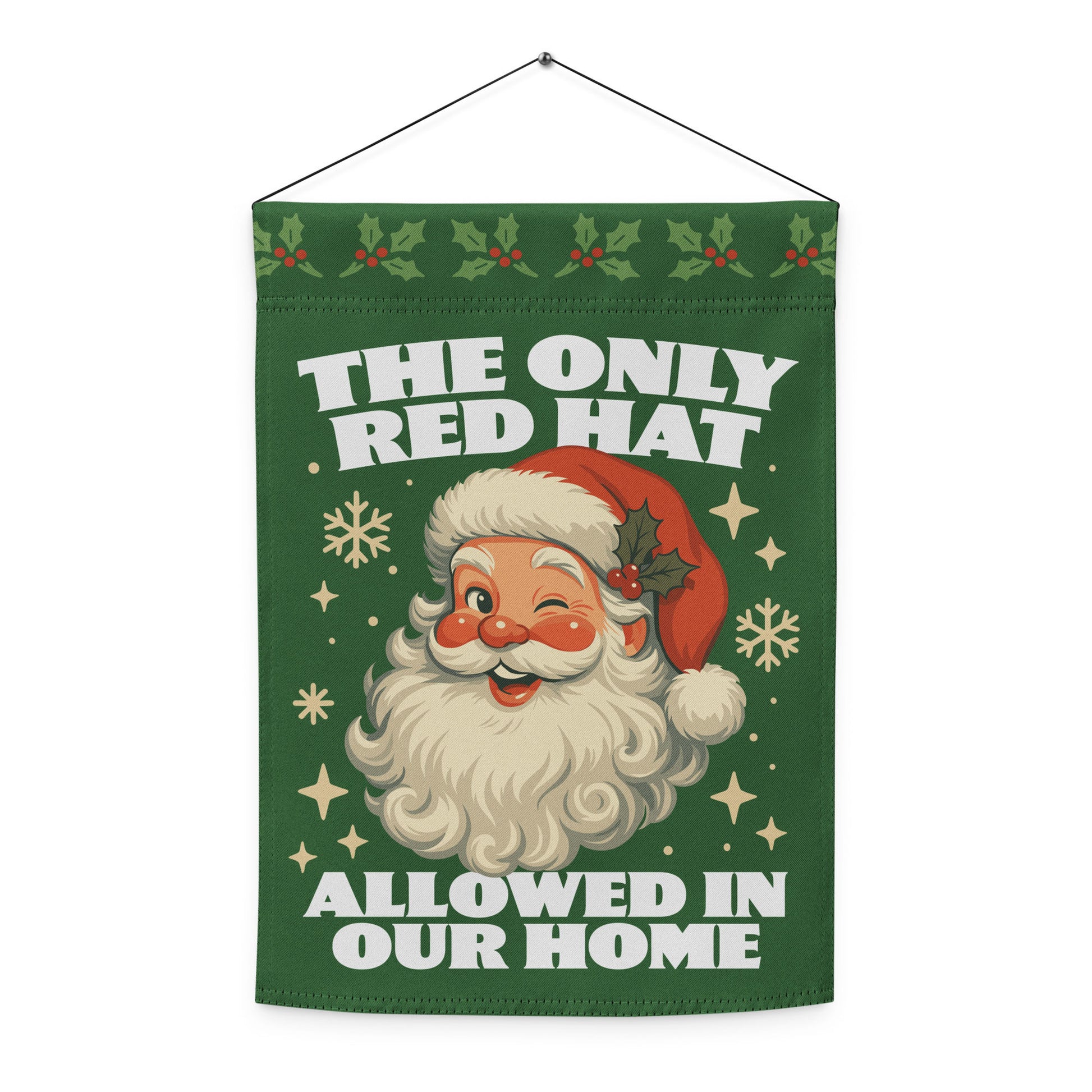 Green hanging garden flag with a vintage Santa illustration, decorative snowflakes and holly, and the message “THE ONLY RED HAT ALLOWED IN OUR HOME,” designed by Blue Wave USA.