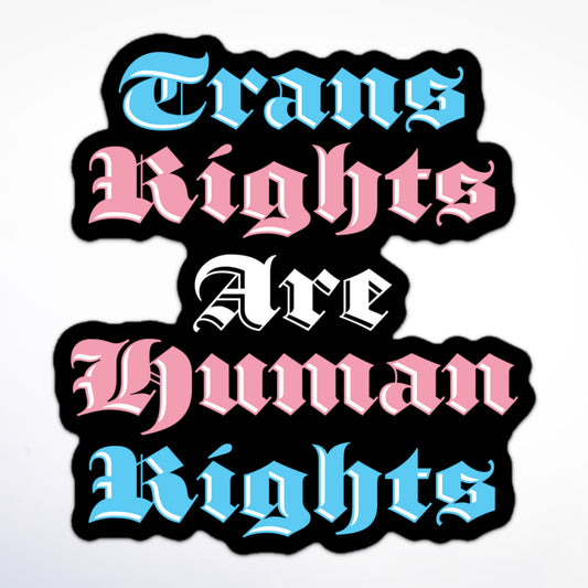 Sticker with bold gothic lettering in pink, blue, and white that says “Trans Rights Are Human Rights” on a black outline.