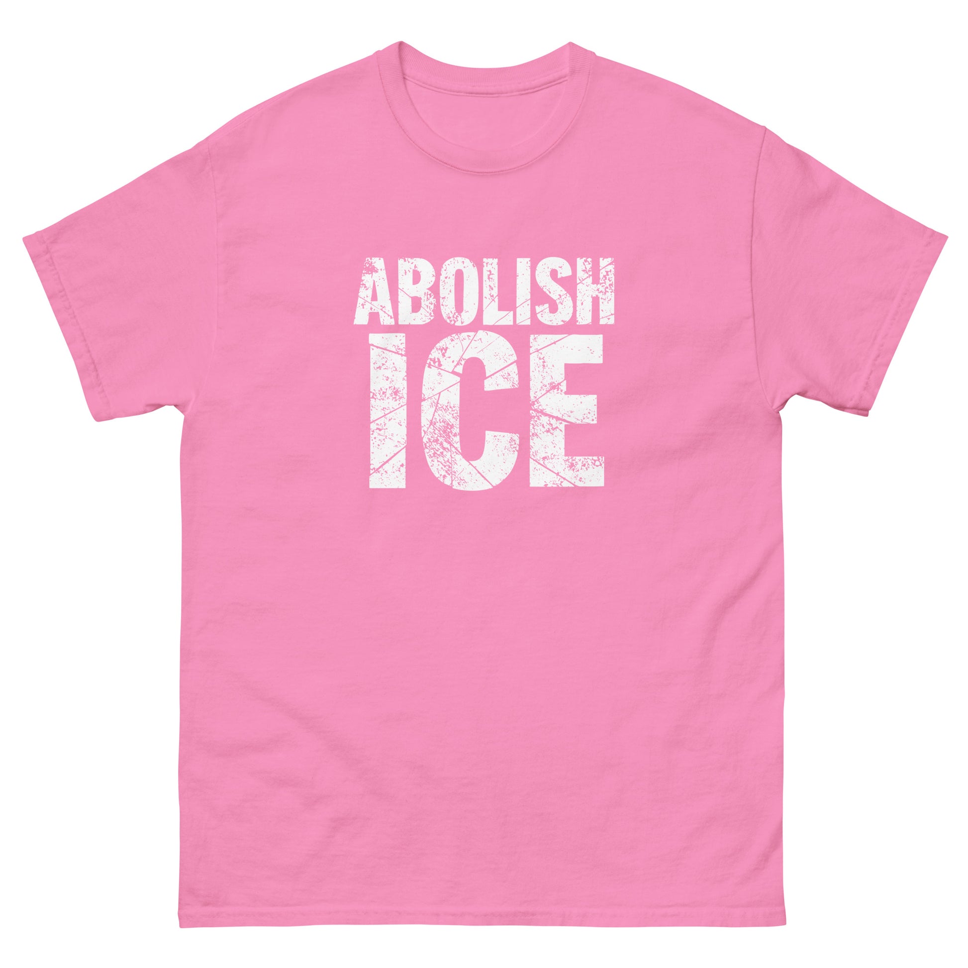 Soft pink unisex classic t-shirt with distressed white block text in a compact protest design, high-contrast lettering with a rough, weathered finish.