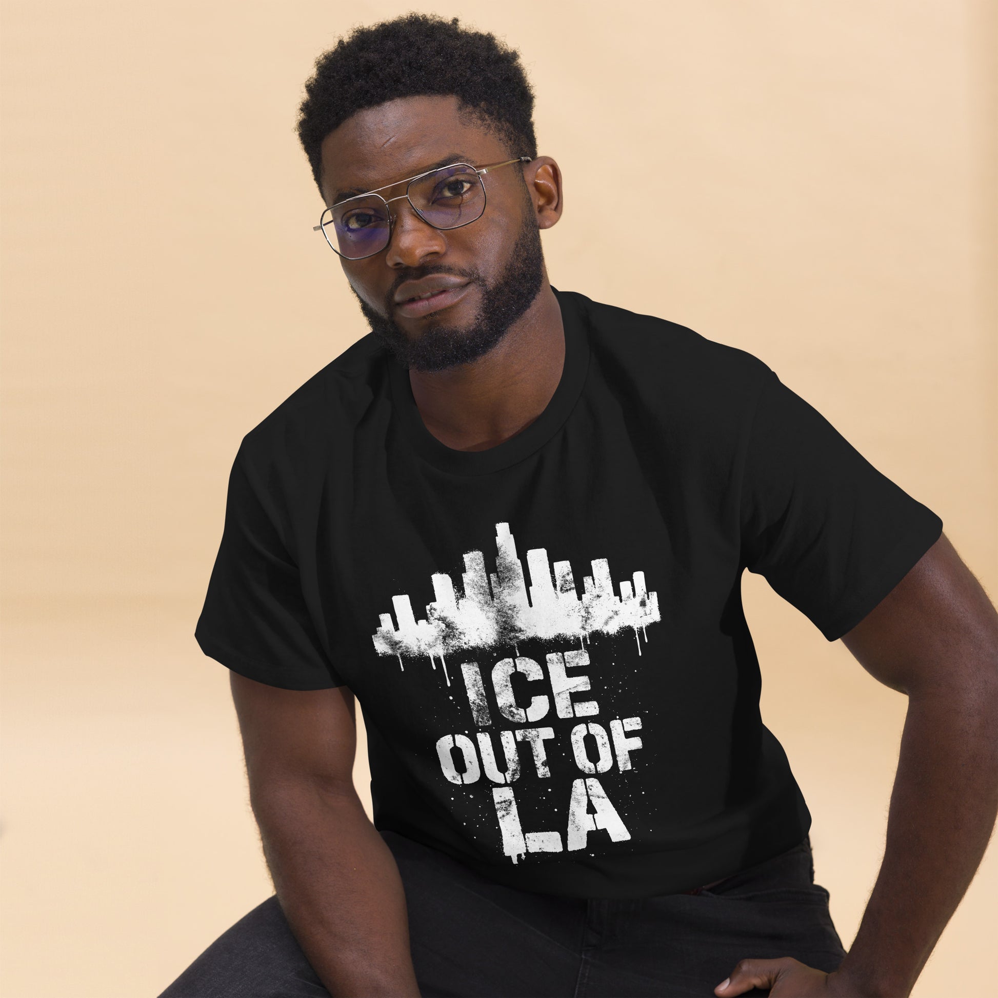 Lifestyle Image: Male Activist wearing ICE OUT OF LA urban resistance protest shirt