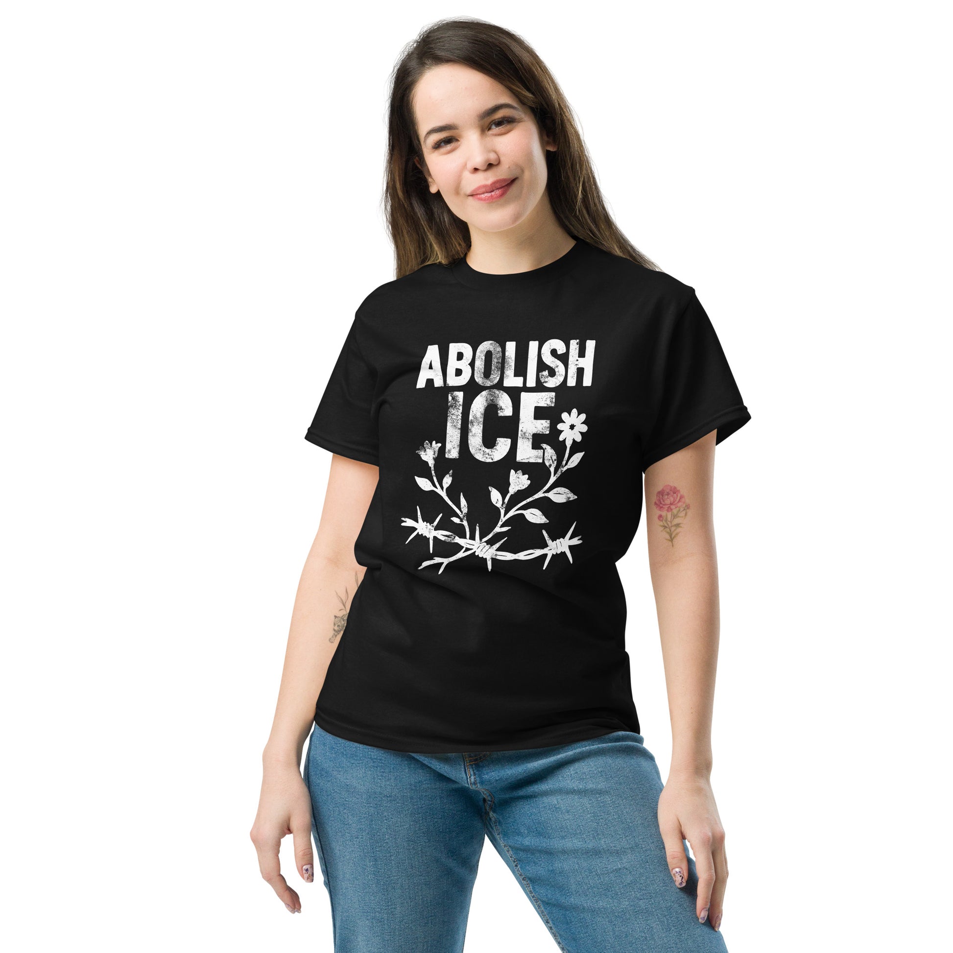 Lifestyle Image: Female Model wearing feminist  Abolish ICE tee with bold floral barbed wire anti-ICE protest shirt