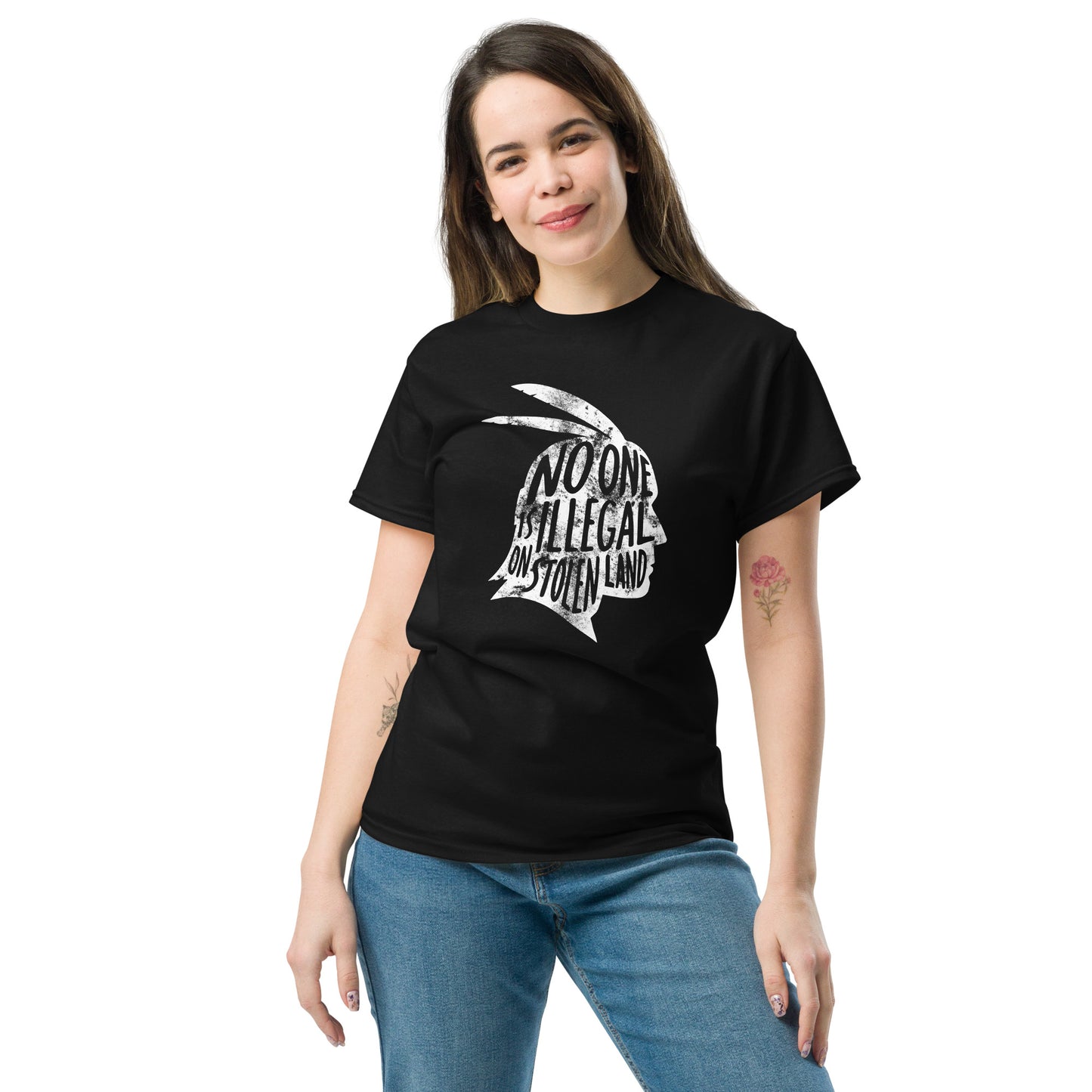 Female immigrant Rights advocate wearing the "No One Is Illegal On Stolen Land" Indigenous & Immigrant Rights Unisex Classic Tee