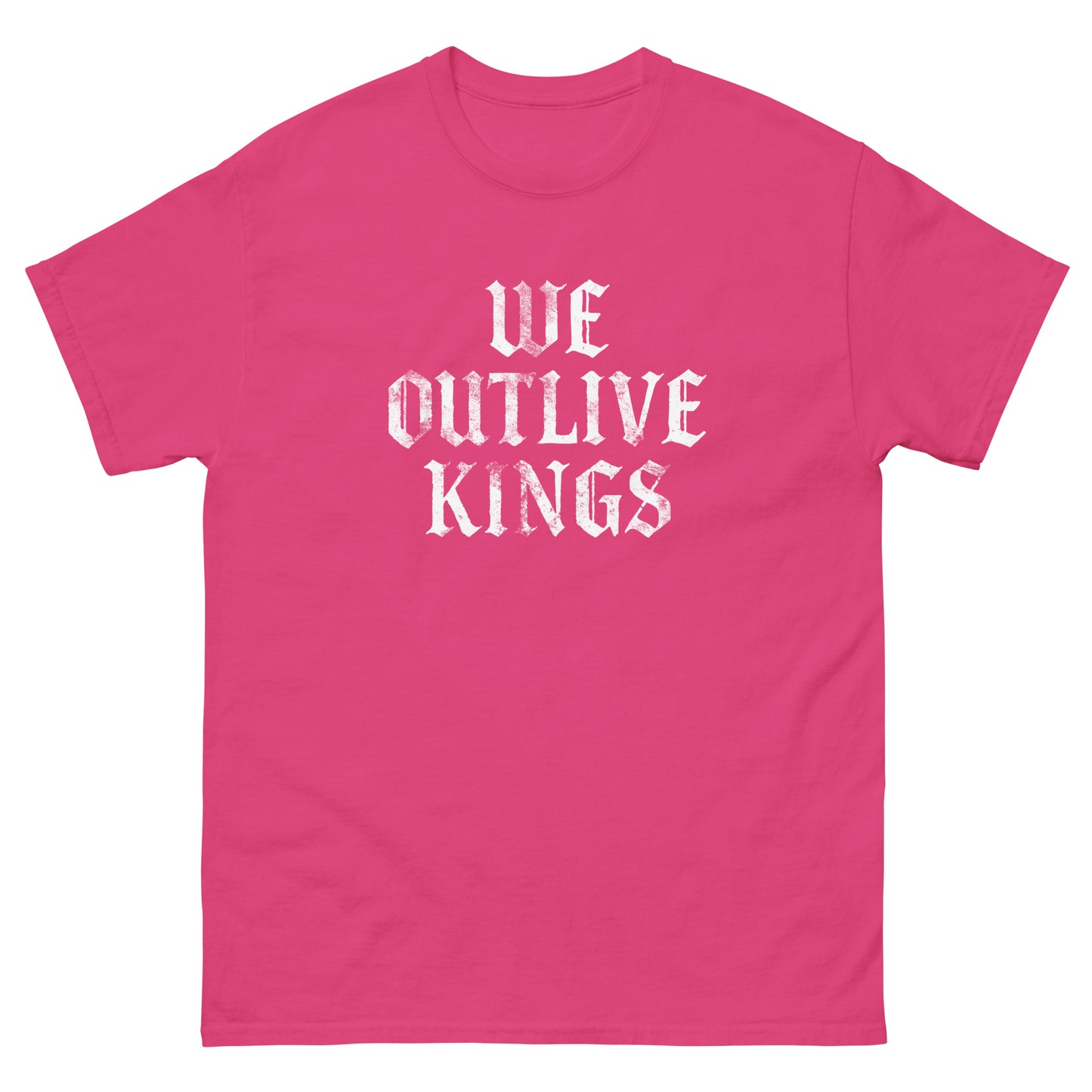 Pink unisex classic tee featuring gothic white “WE OUTLIVE KINGS” typography, bold anti-monarchy protest message for pro-democracy progressive apparel.